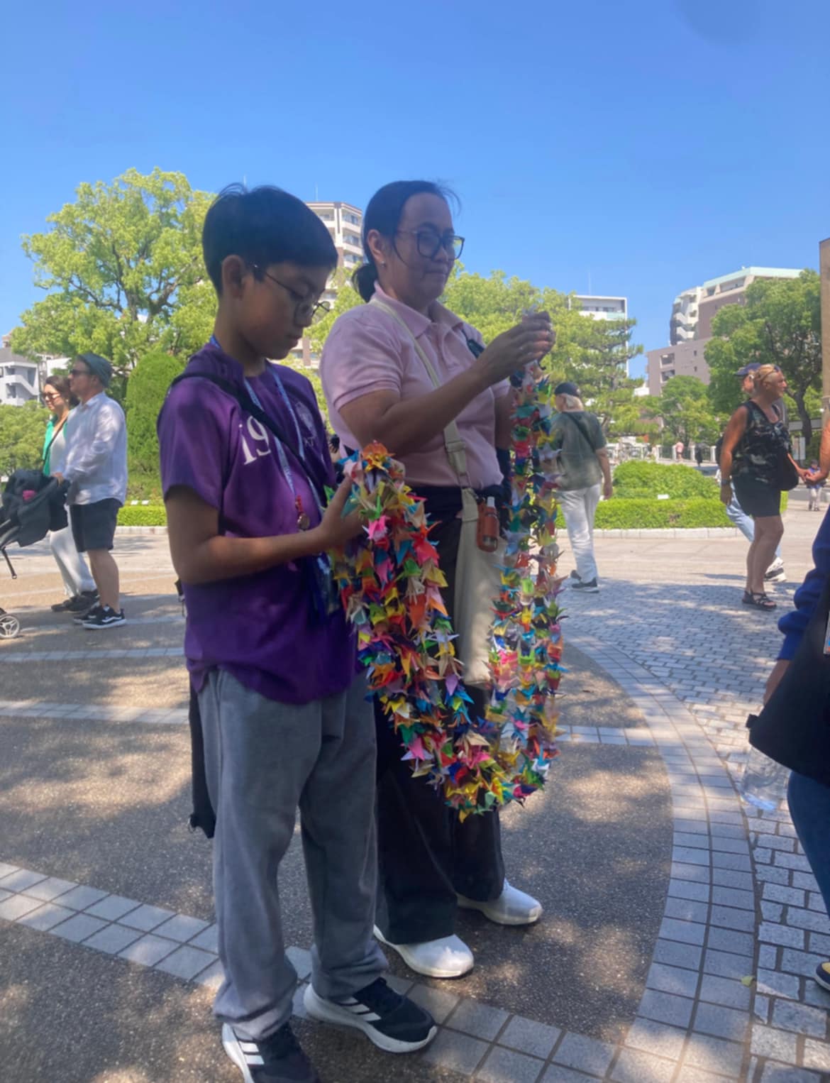 Marcus leading the offering of 1000 peace cranes made by AGS student leaders and students at the Children's Peace Monument in Hiroshima Peace Memorial Park