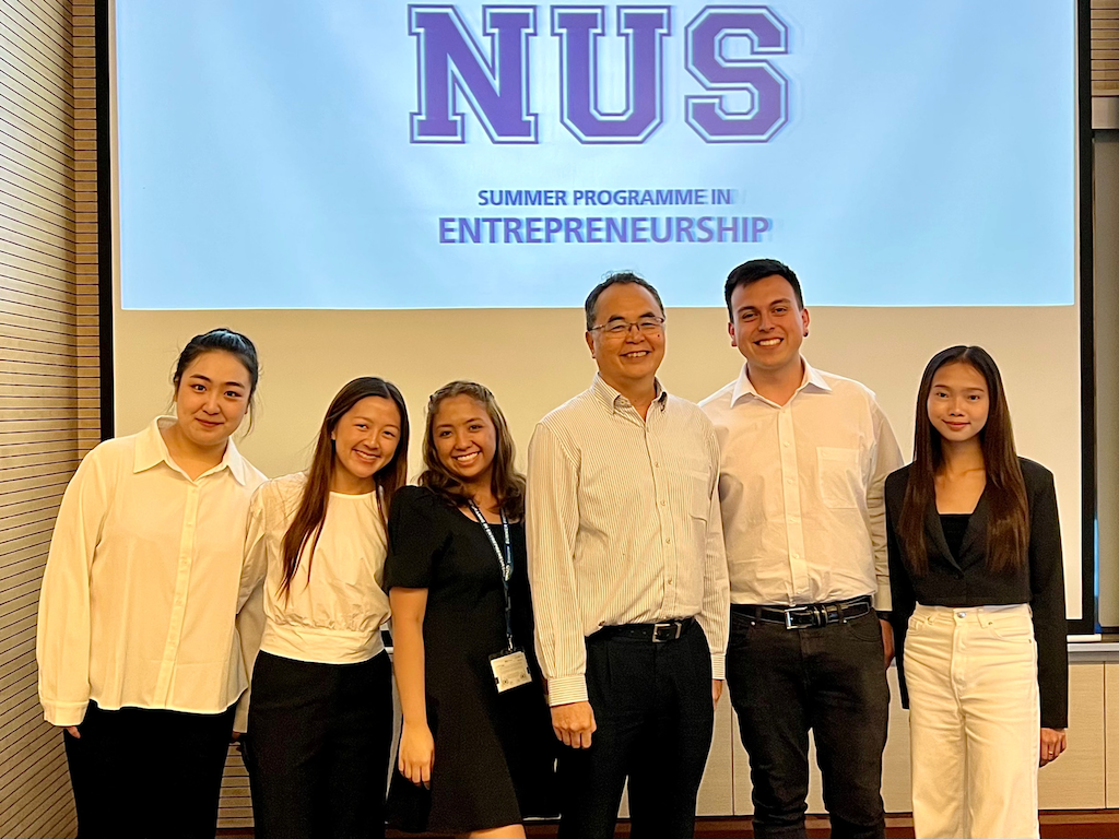 My group with one of the panelists at Demo Day, where we pitched our startup idea