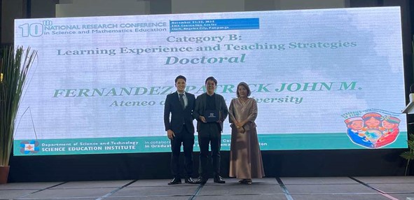 Mr. Patrick Fernandez receiving an award.