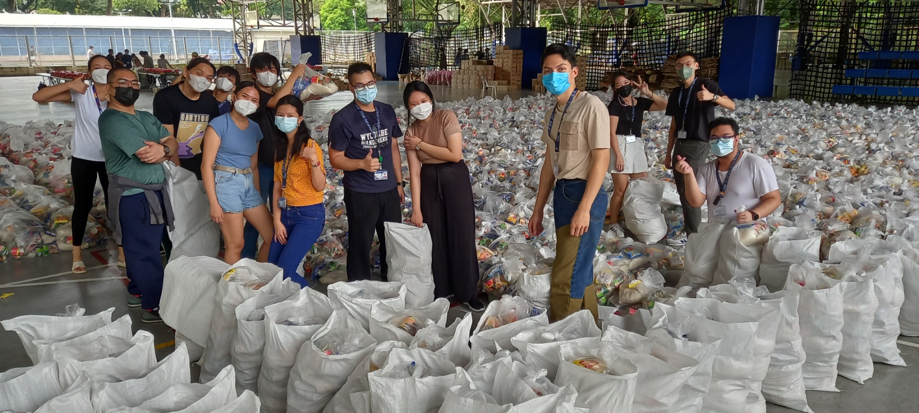 2022_9_30_Karding Relief Goods_Happy Student Volunteers with Half-filled LSCC