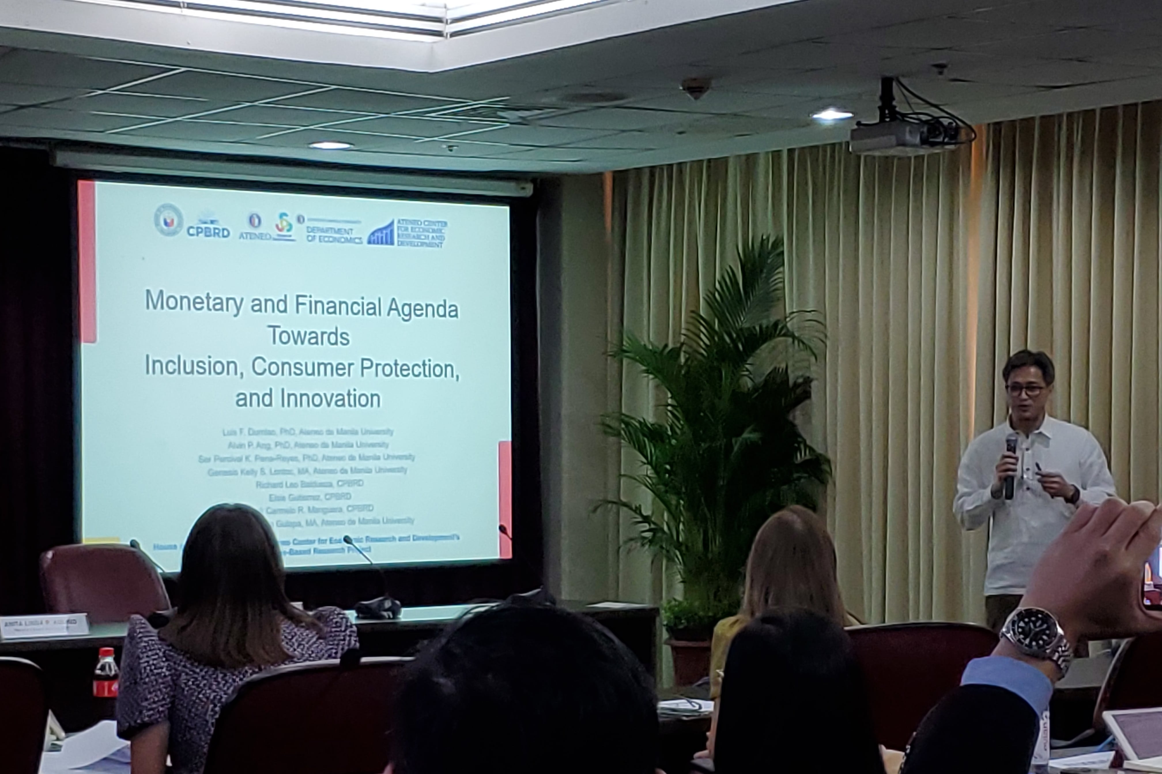 Dr. Luis Dumlao, Hrep-ADMU Congressional Research Fellow presenting his team’s research on monetary and financial stability
