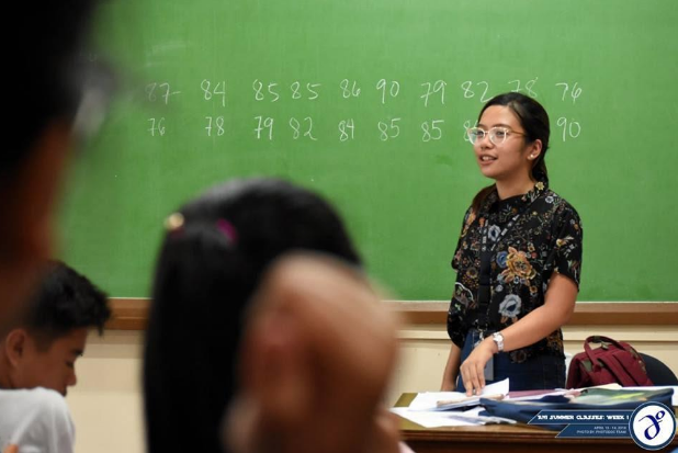 ANI Tutor-Adviser and ANI EB, Raven Ico teaching basic statistics to Grade 11 students from public high schools