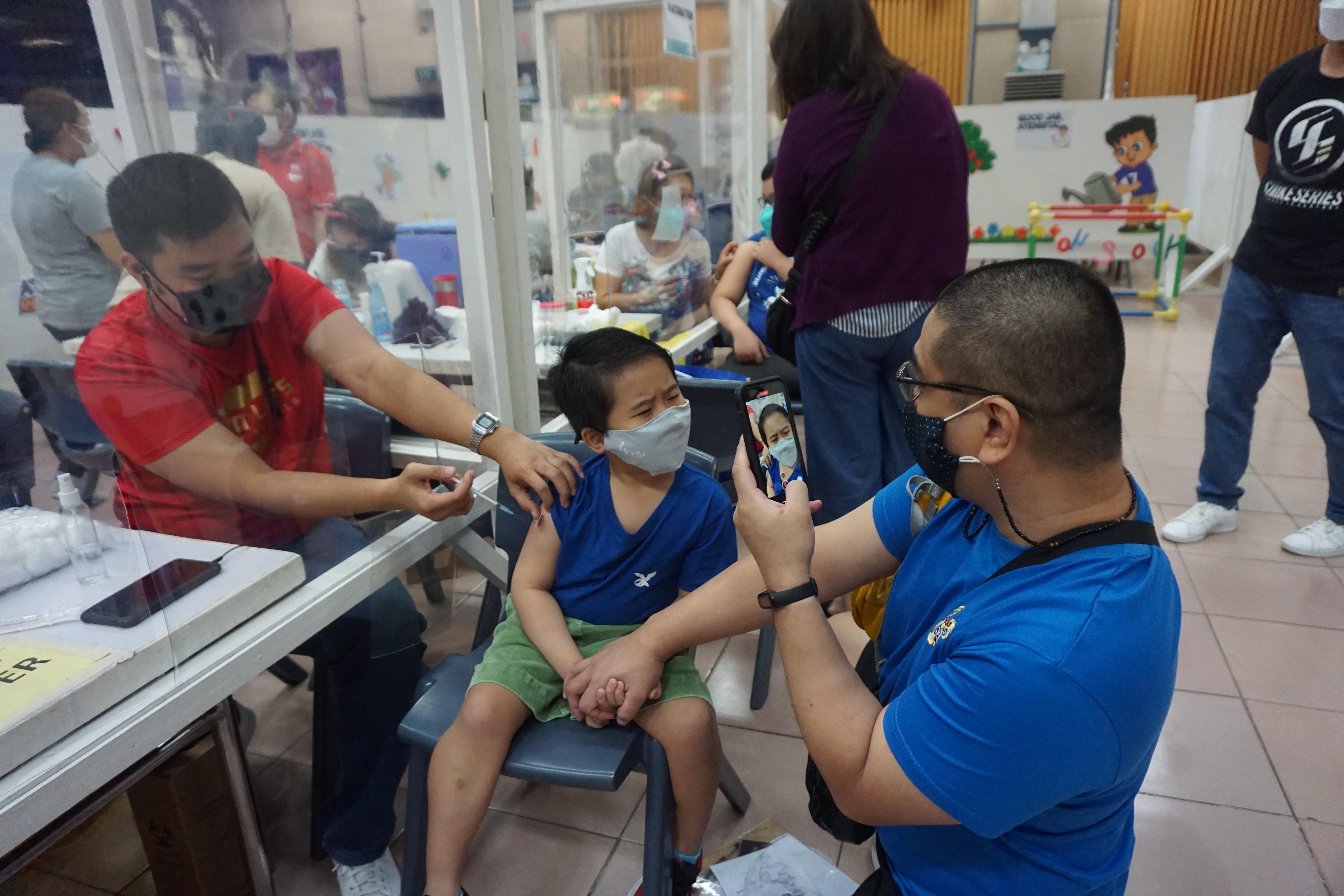 Joaquin, grade 1, says the jab "kinda hurt."