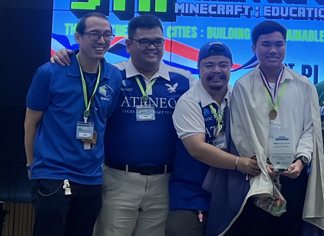 (L-R) Joel Falgui, Jason Arias, Lavi Subang and Liam Daga onstage after Daga received his champion trophy