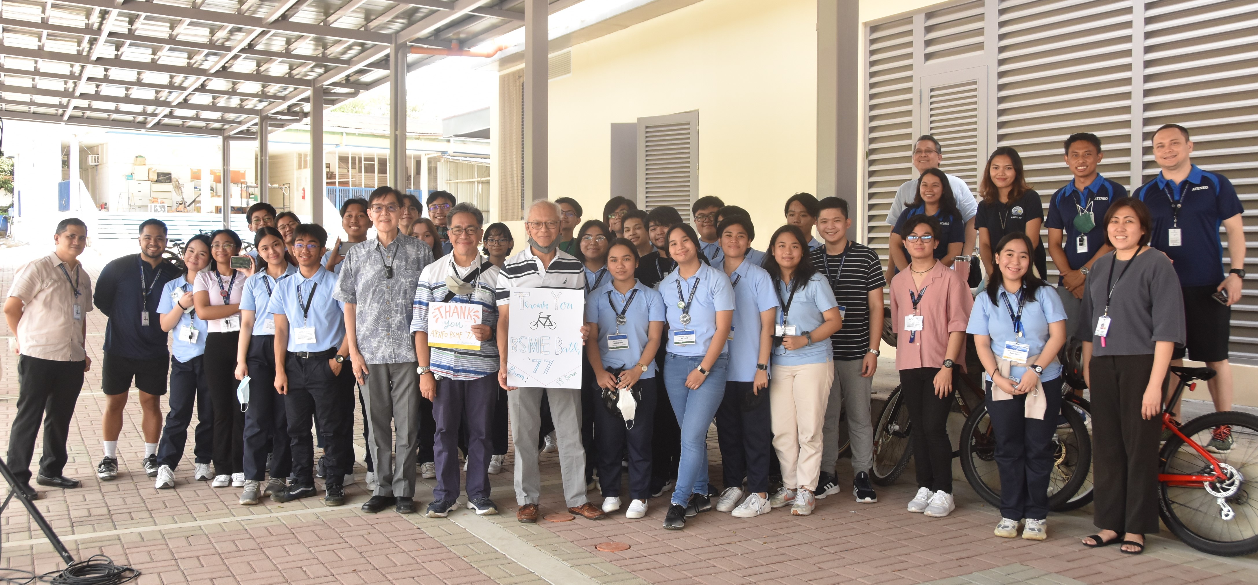Surrounded by ASHS administrators, faculty, and students, the BS ME Class of ‘77 reps pose with the notes of gratitude given to them by the students.