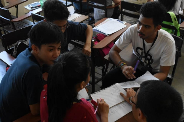 Abraham (right) in a group work during their Communications subject