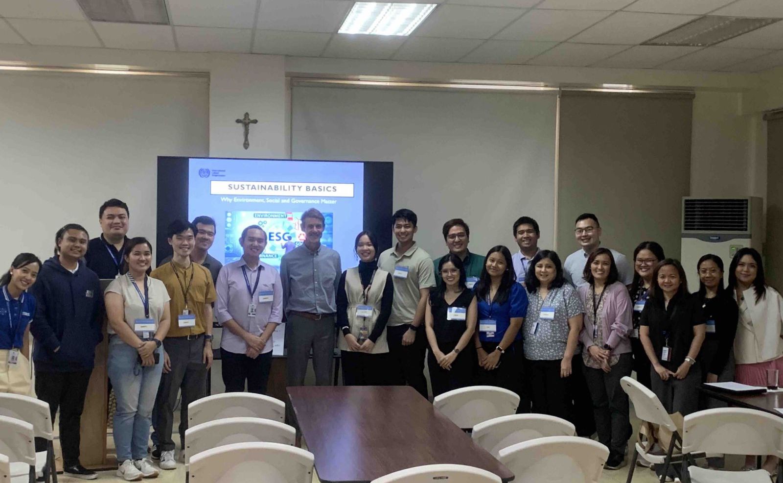 Guests, colleagues, and members of the community partake in a group photo. Photo by AIS.