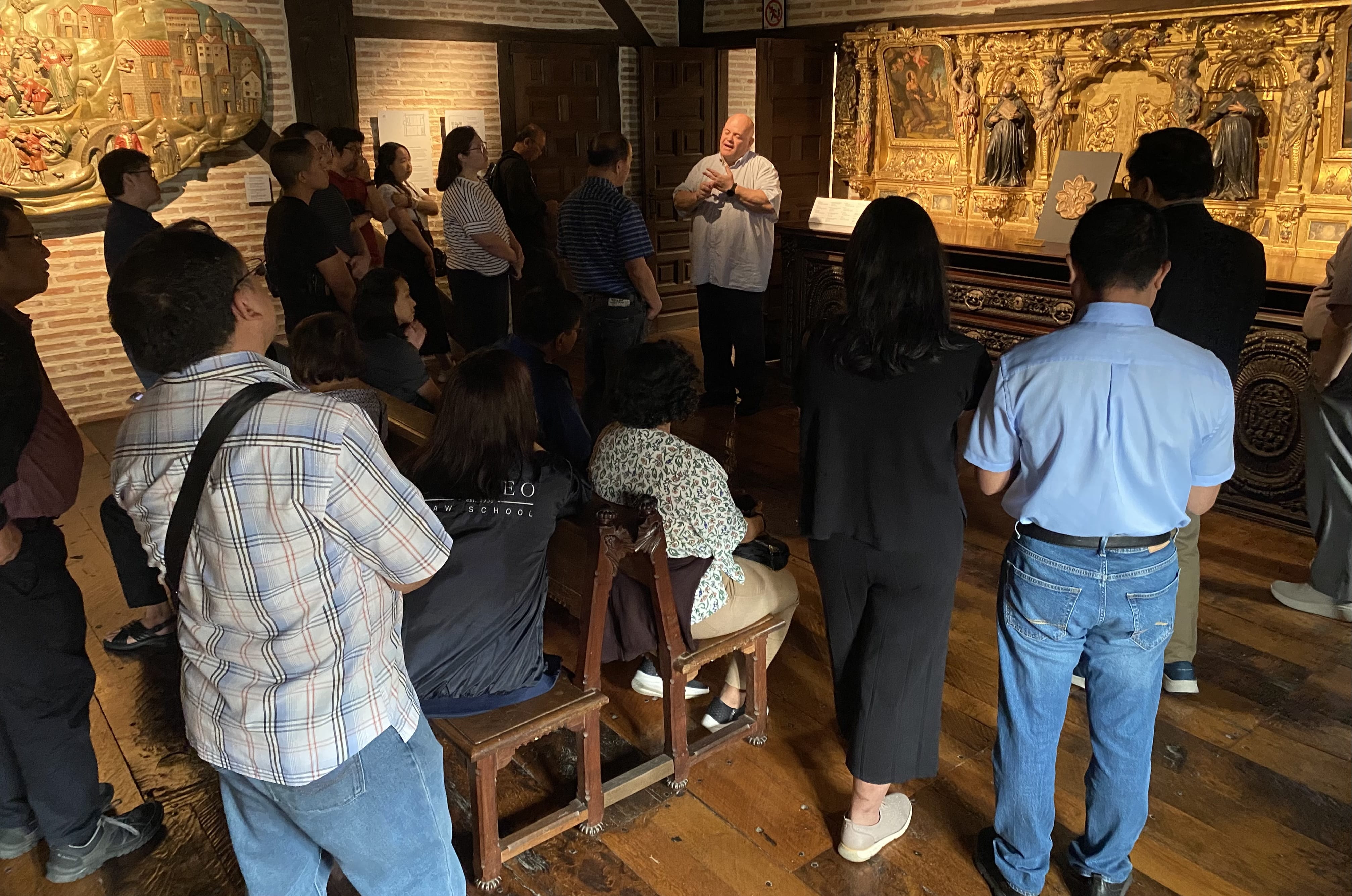 At St Ignatius resident with Fr. Peo touring the group