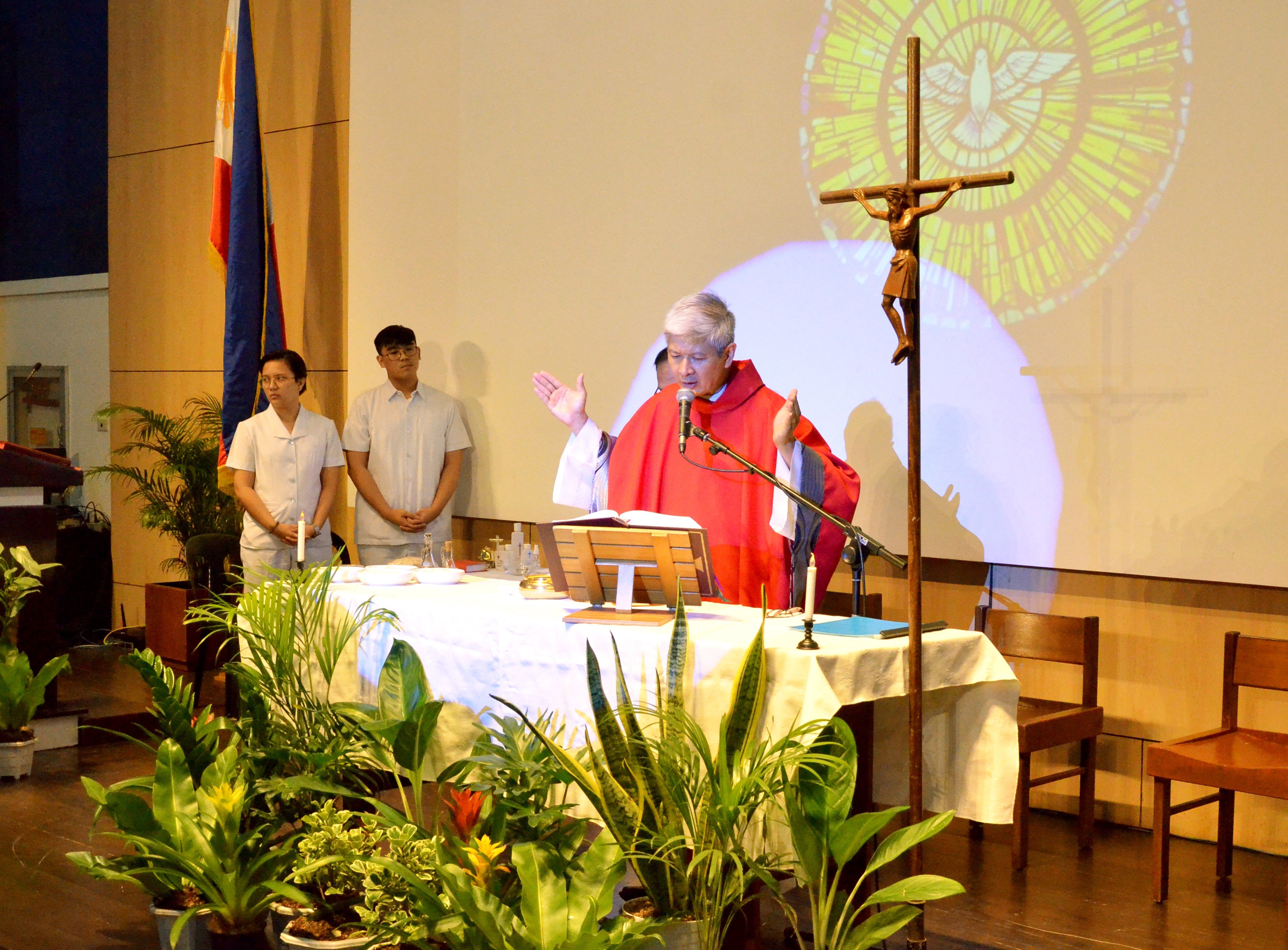 Fr Robbie Sian during the mass of the Holy Spirit