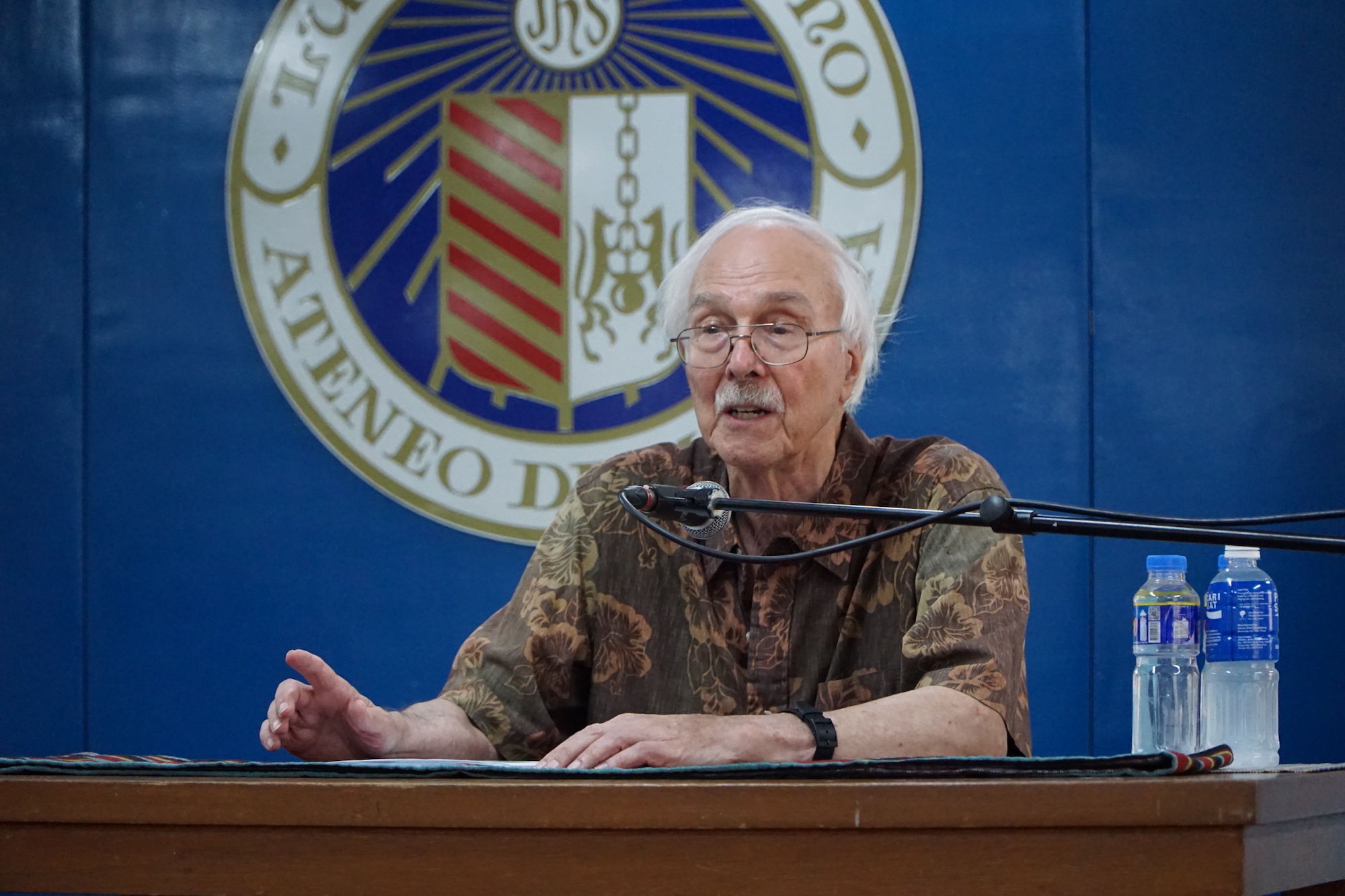 Professor Warren addresses the members of the audience
