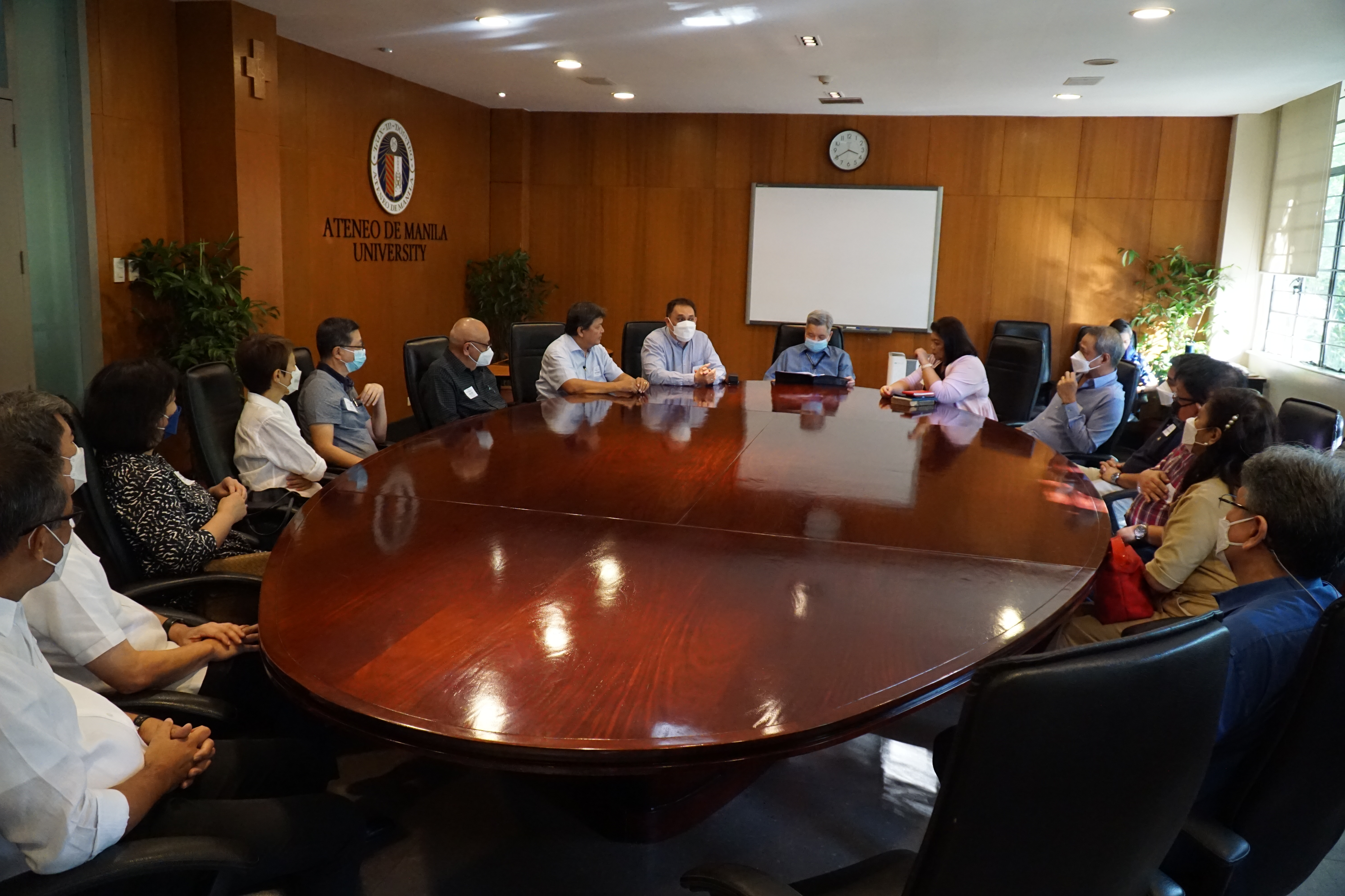 Members of Batch ’82, with Fr. Bobby, during the MOA signing