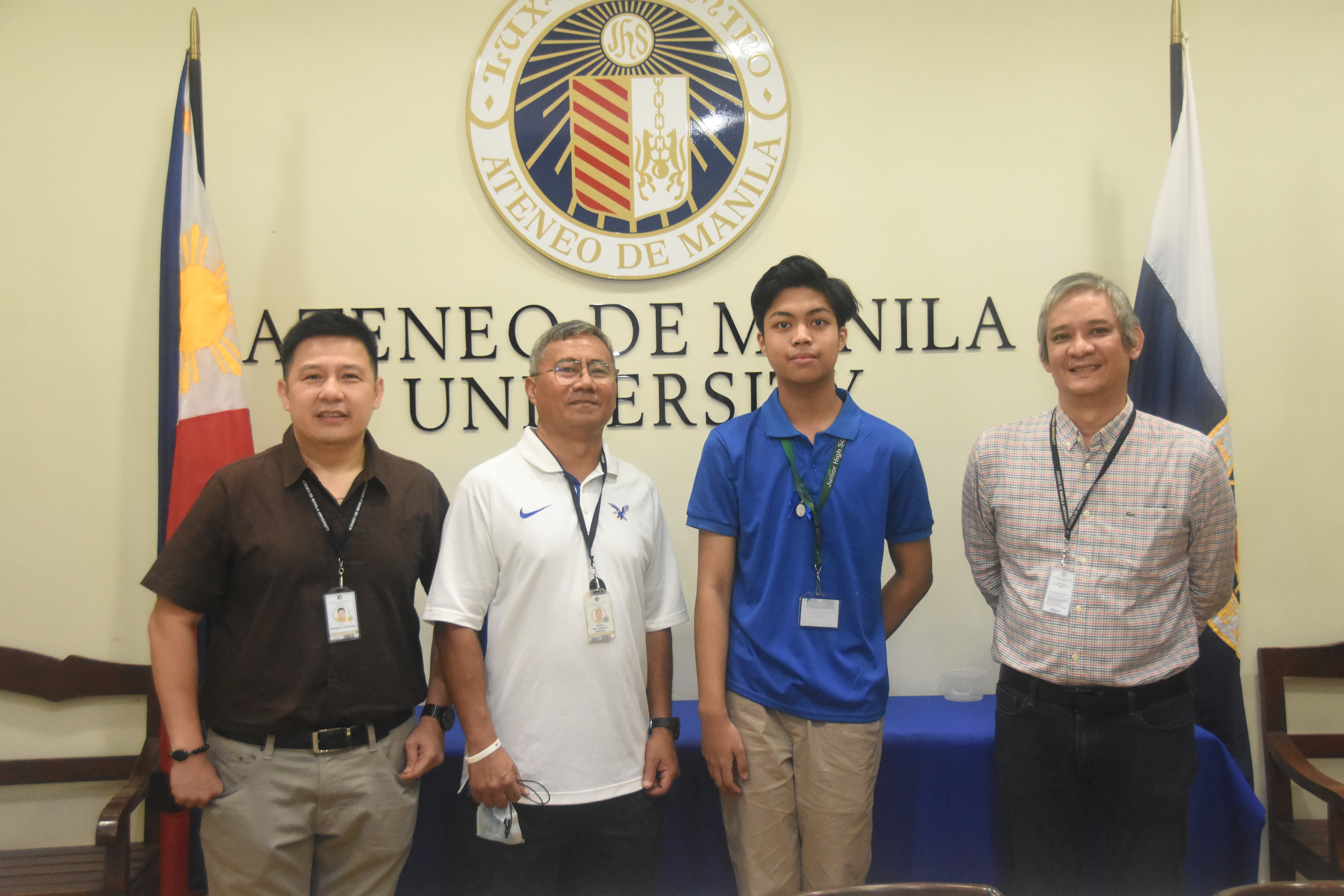 (L-R) Ron Capinding, Assistant Principal for Formation; Raul Albarece, Athletics Coordinator; Michael Lacerna; Jonny Salvador, Principal 