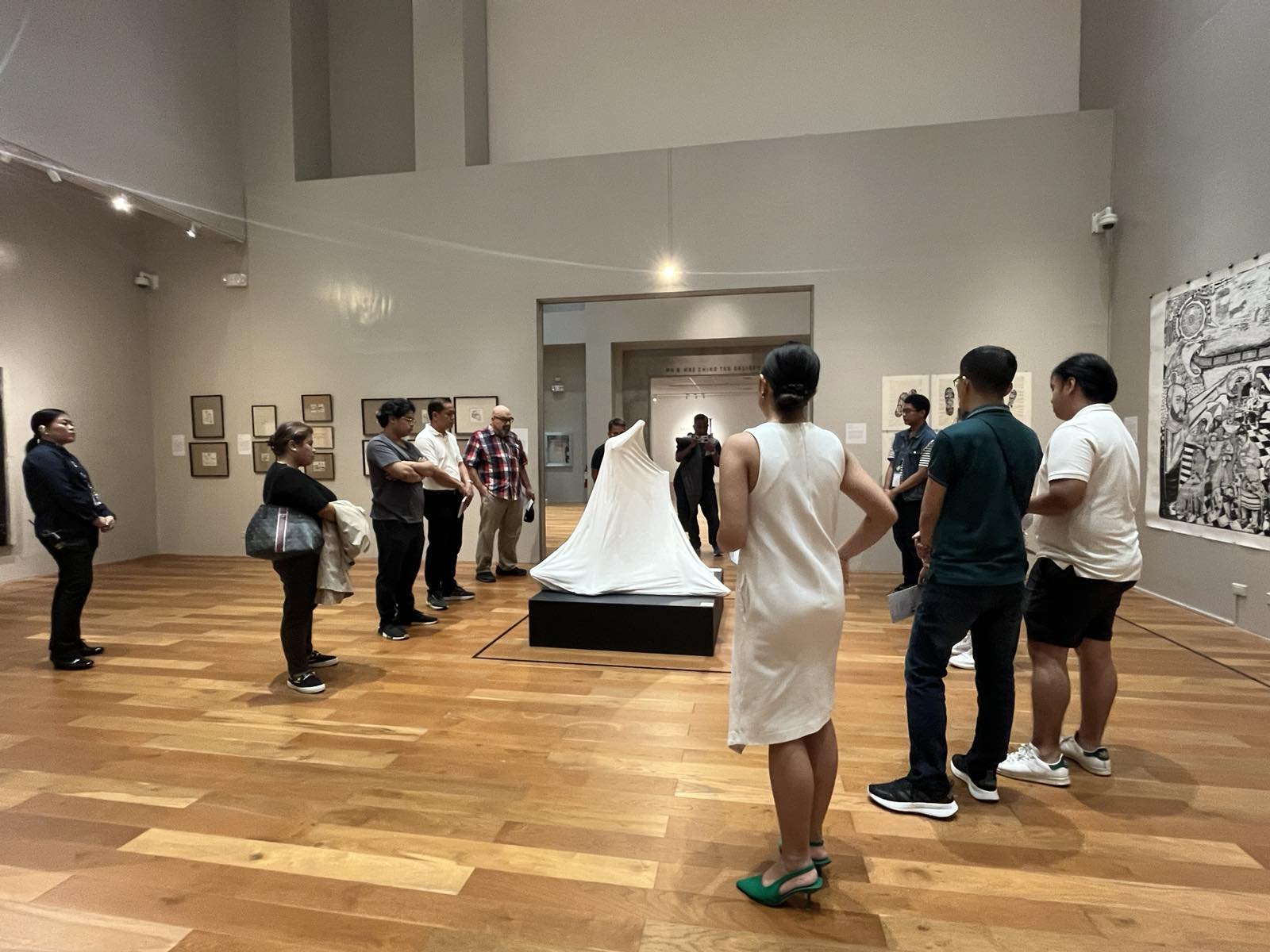 History in the Age of Disinformation’ attendees examine a statue as a part of the tour in the Ateneo Art Gallery, Arete.
