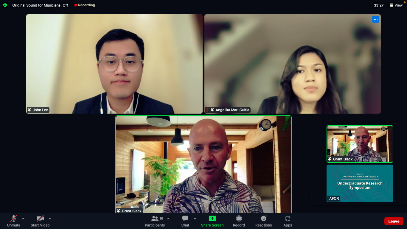 Lee and Gultia  join panelists from the International Academic Forum after doing their poster presentation.