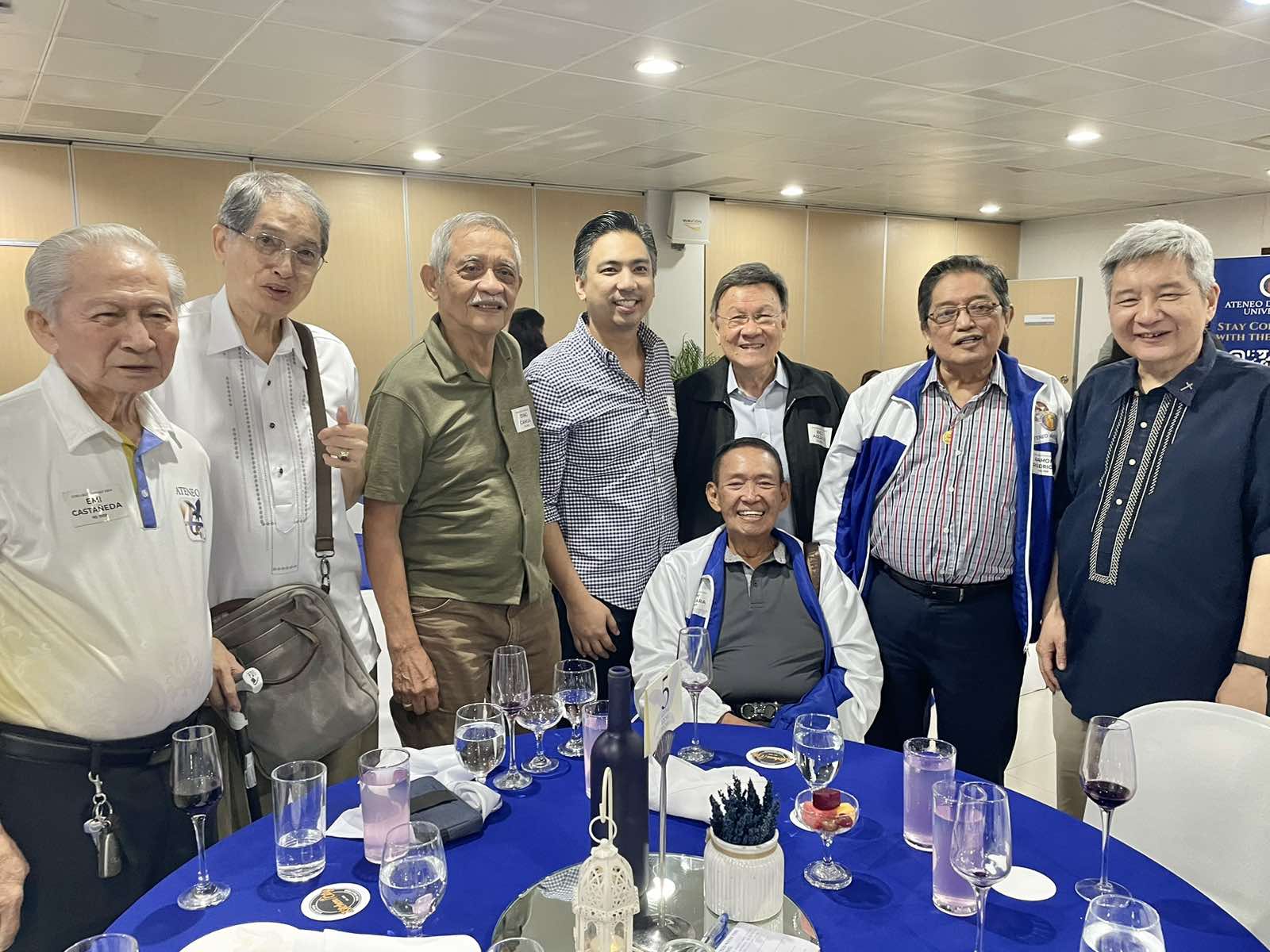 From left to right (standing): Emi Castañeda (HS 1959), Willie Villarama (College 1964), Ding Camua (HS 1959), Paolo Bugayong (HS 1999), Rico Agcaoili (College 1969), Ramon Rodrigo (HS 1959), and Ateneo de Manila University (ADMU) President Fr. Bobby Yap, SJ. (Seated) Domingo Guevara (HS 1959).
