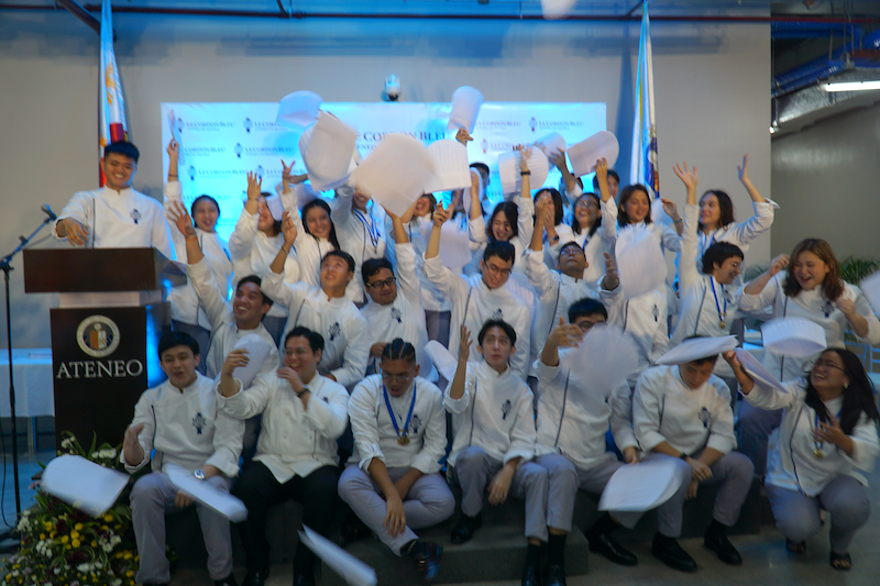 The class of 2023 throwing their toques