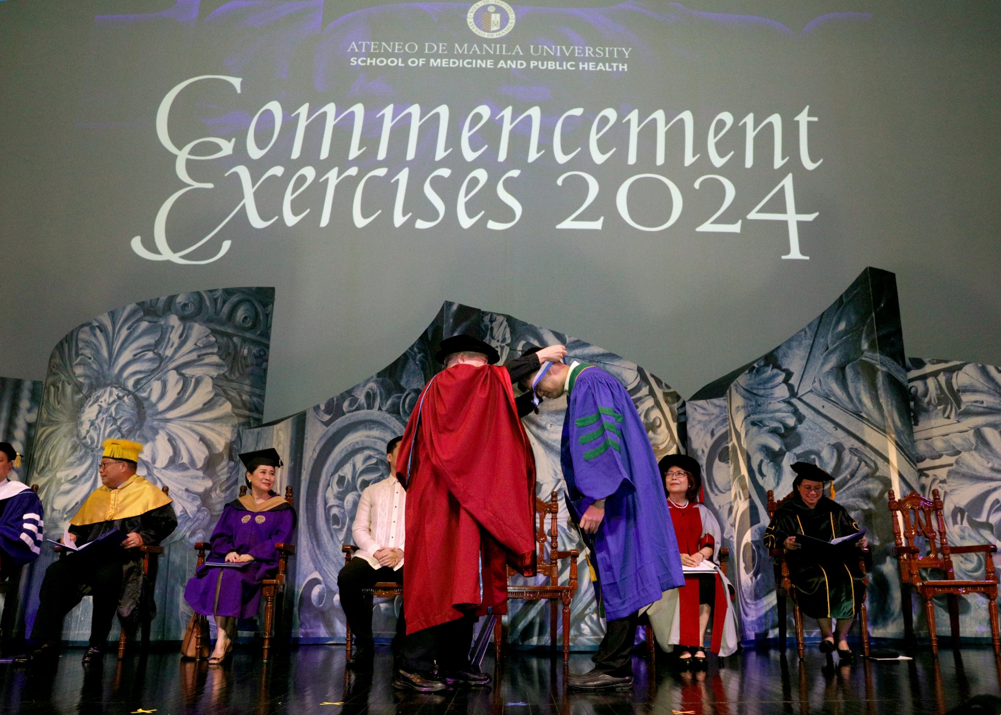 ASMPH Valedictorian receiving medal from Fr Bobby