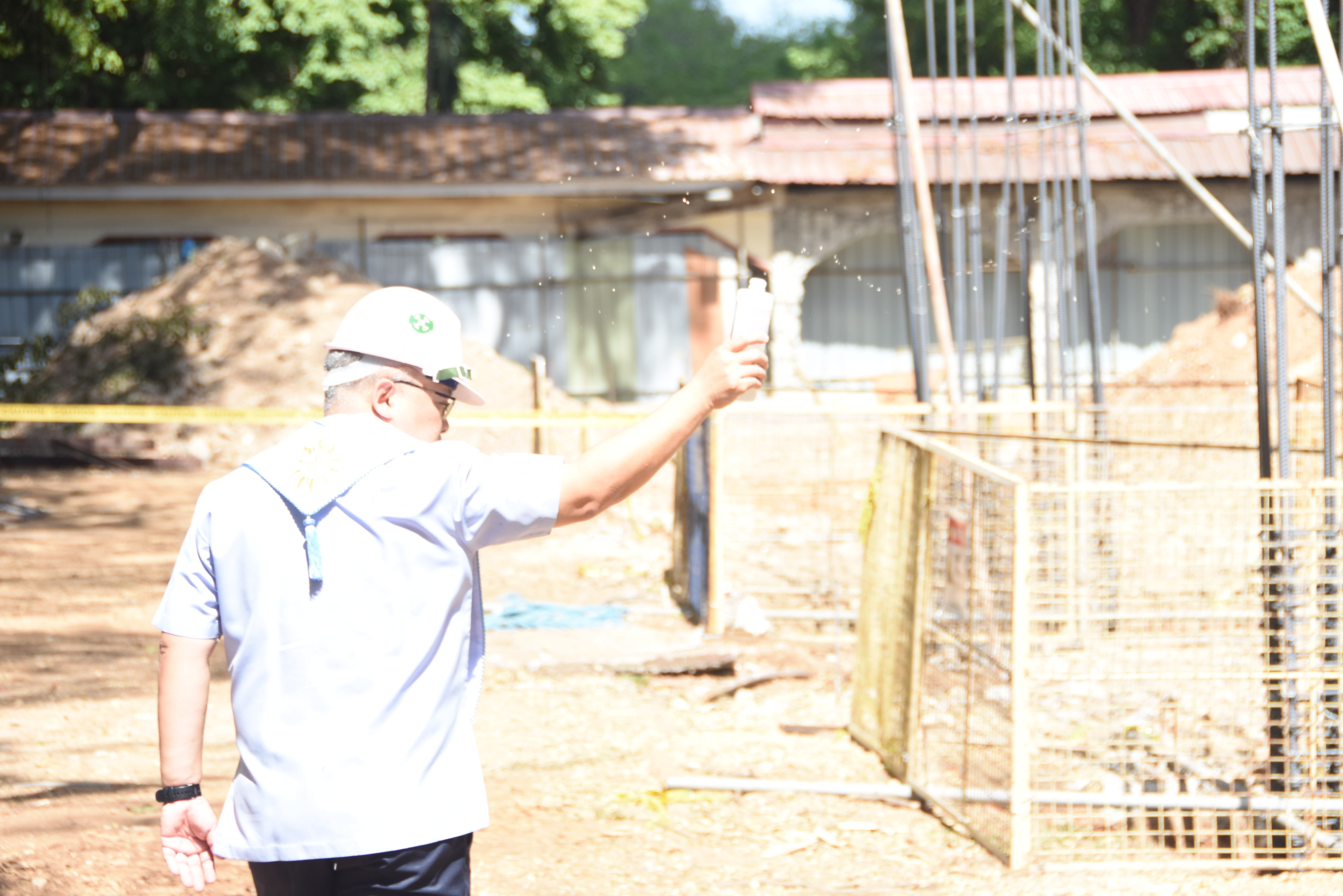 Fr. Jonjee Sumpaico SJ blesses the site 