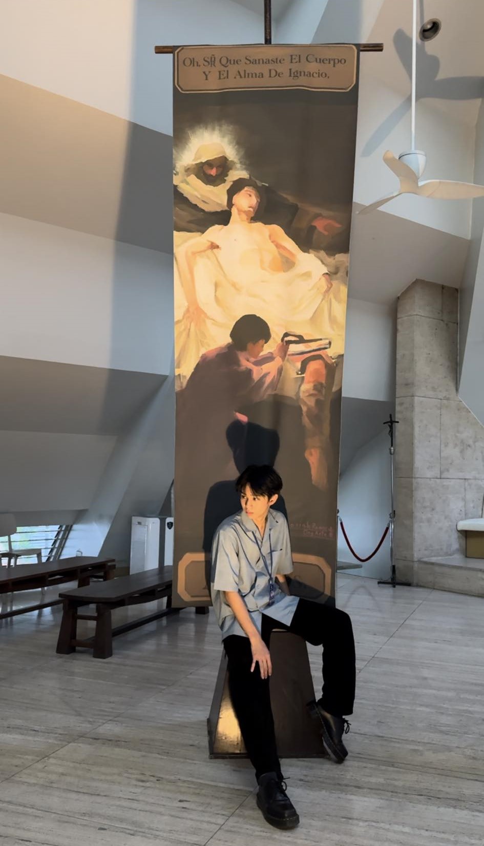 The artist poses with his creation in the Church of the Gesù