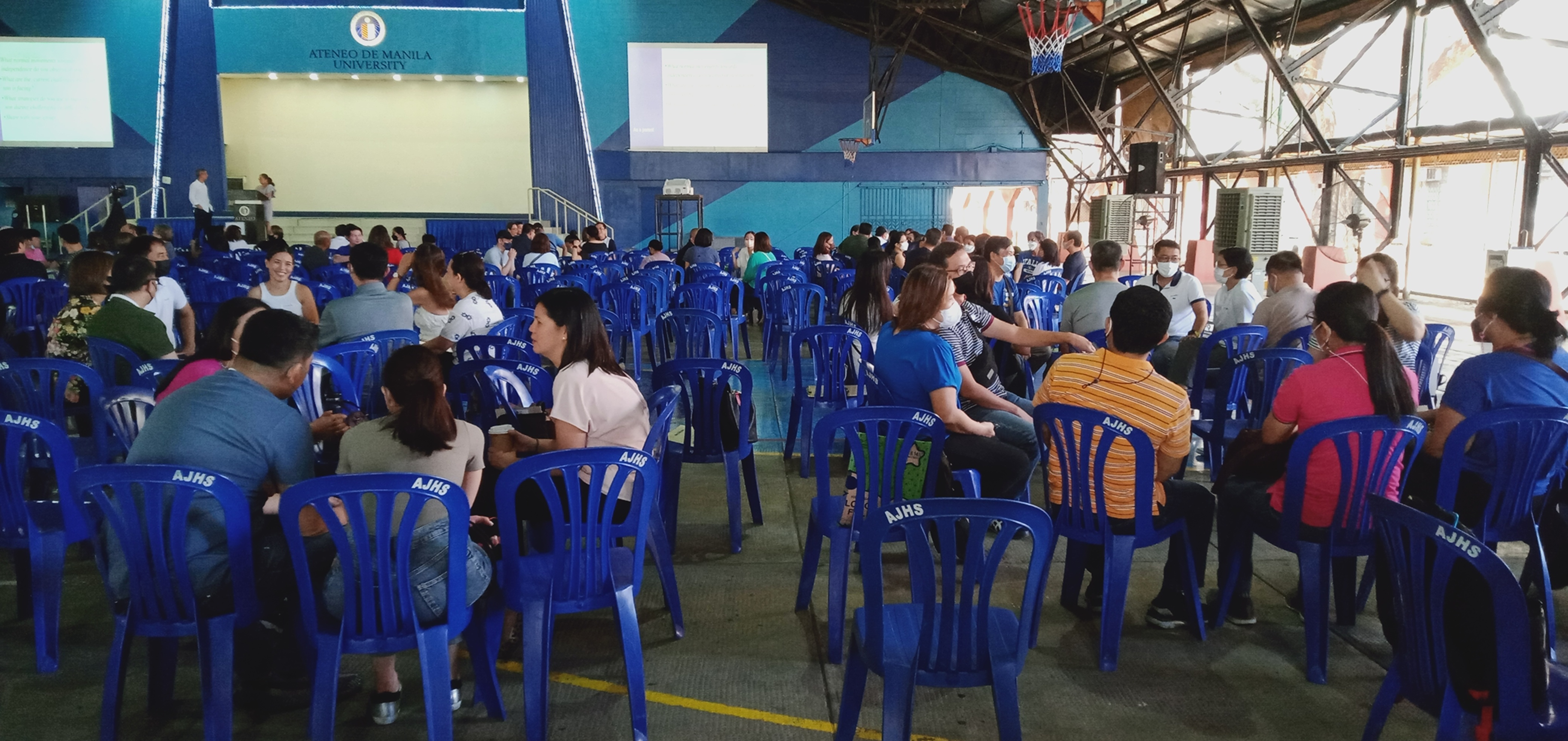 Parents discussing the challenges of raising teenagers during the group sharing