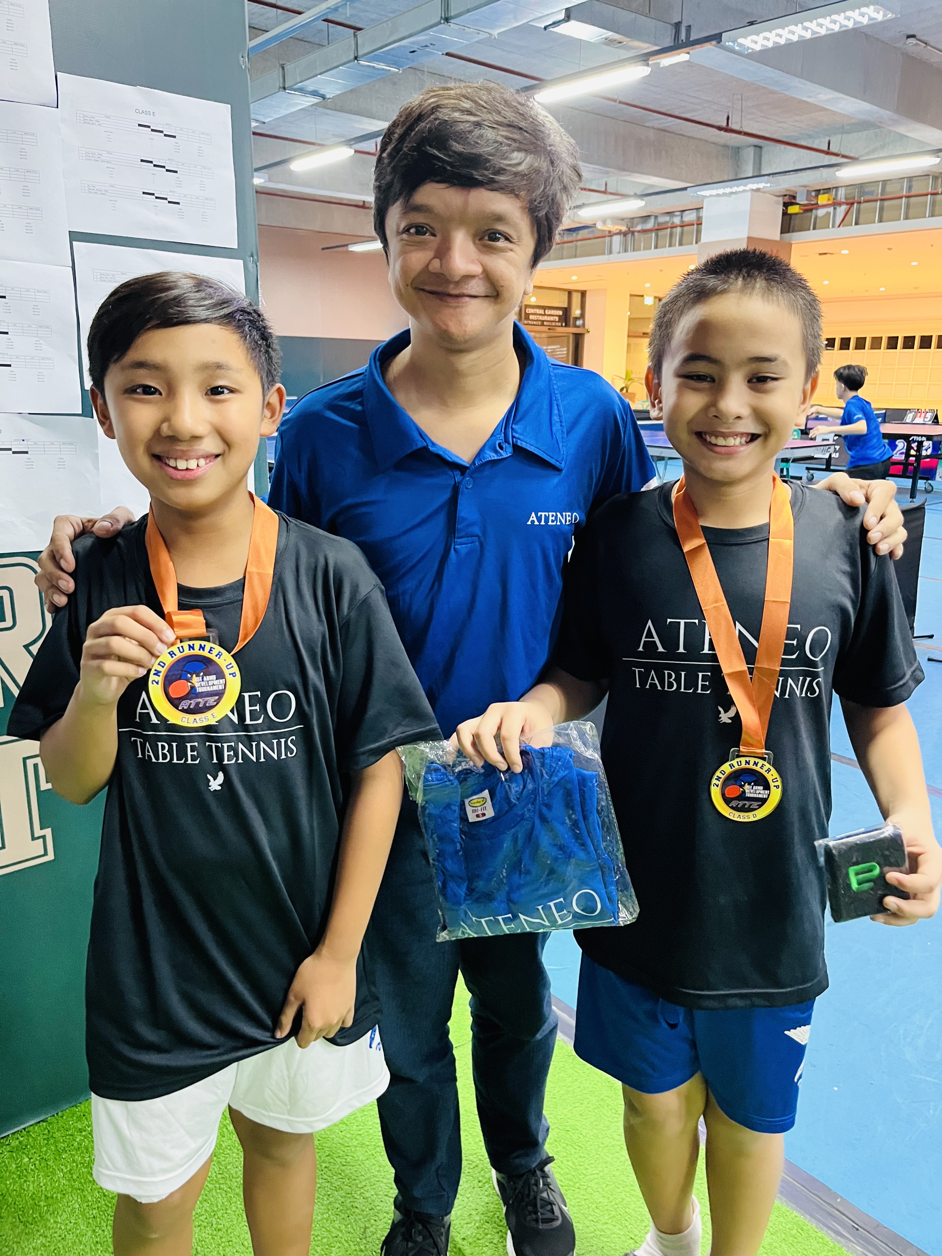 Philo Go, Coach Mihali Crisostomo, and Titus Pachica