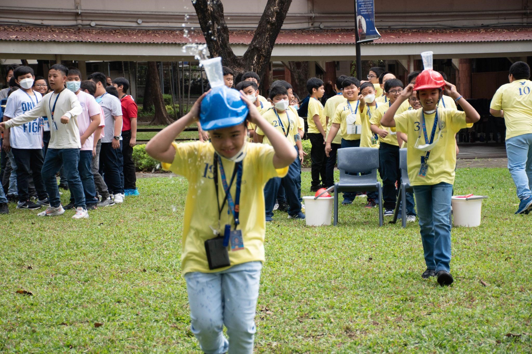Grade 5 boys learn about the meaning of the sacraments through interactive activities