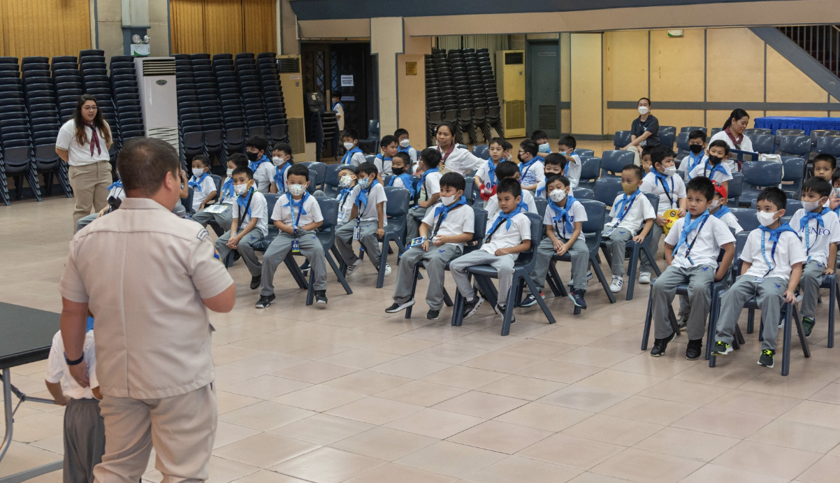 Young scouts captivated by tales shared by Scouter Vergara during their "cool-minating" activity