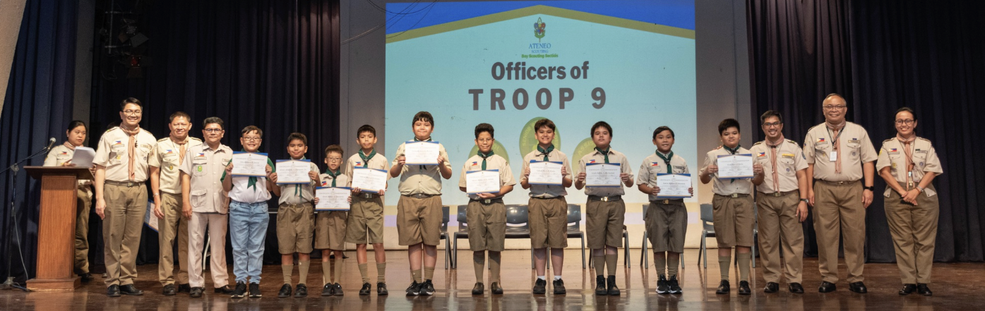 A moment of pride and accomplishment: Boy Scouts receive their hard-earned badges at the Court of Honor ceremony