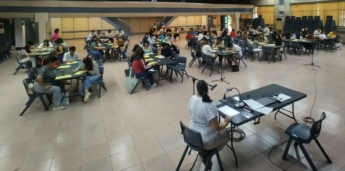 Ms. Madroño guiding the parents as they answer word problems