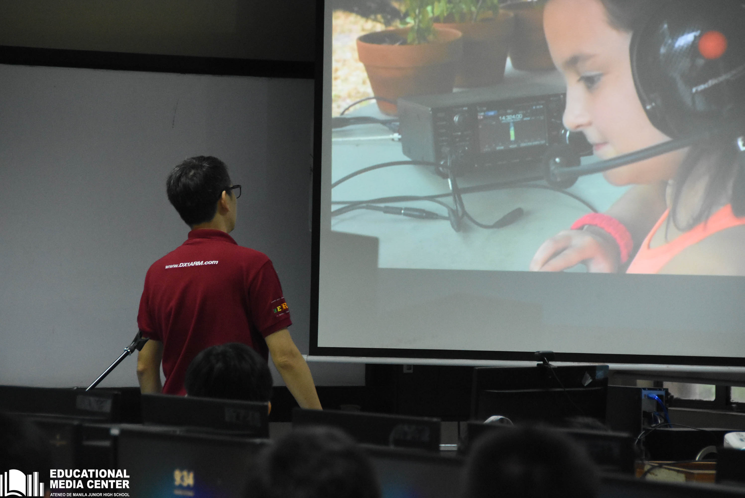 The instructor from DX1ARM shows the scouts a video about the joys of amateur radio
