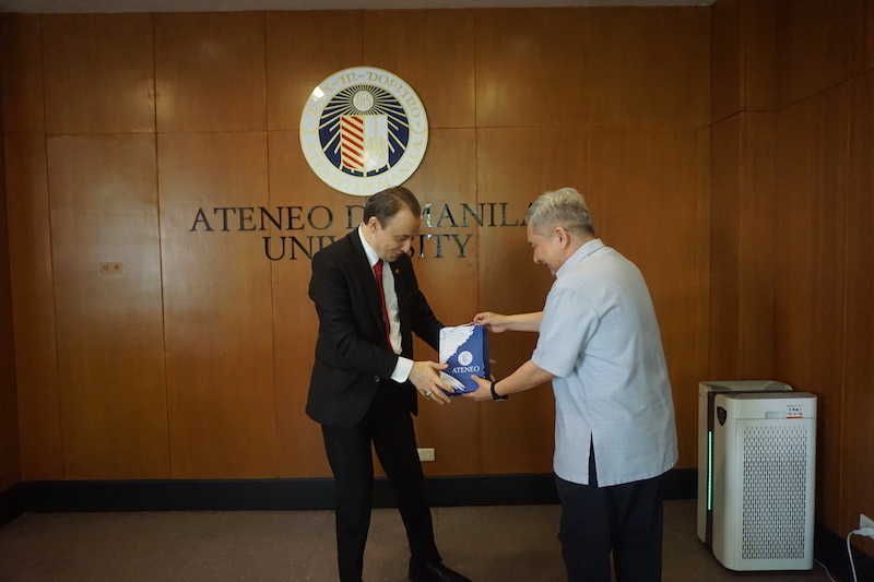 Fr Bobby Yap SJ presenting a gift to Ambassador H E Niyazi Evren Akyol