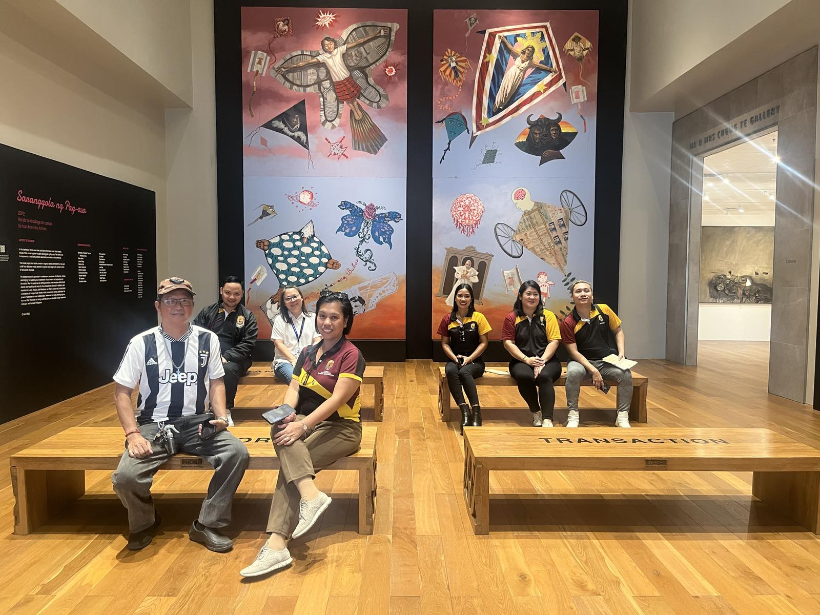 Both parties pose in front of the ‘Saranggola ng Pag-asa’ painting inside the Ateneo Art Gallery at Arete.