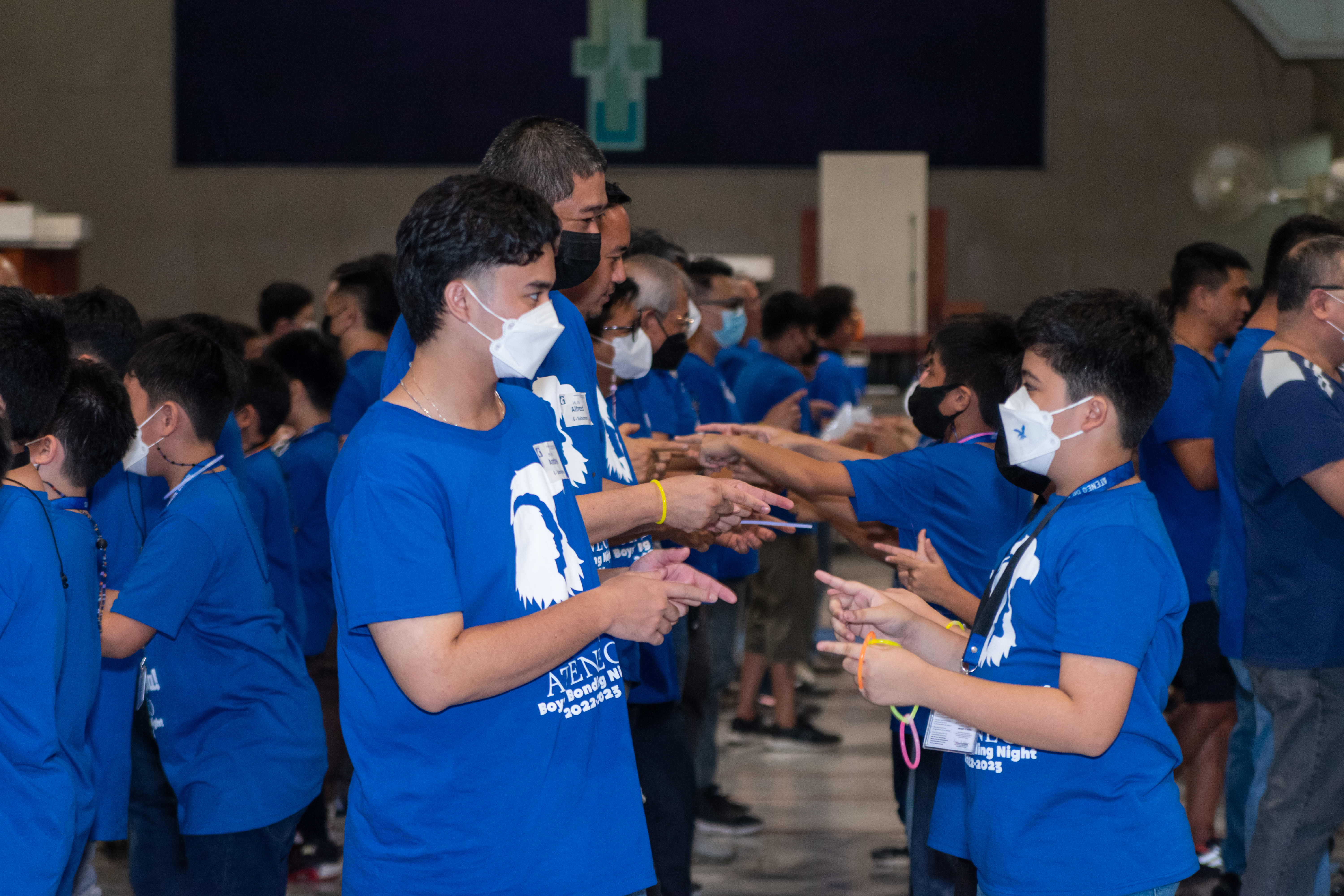 An older brother accompanying his Grade 5 sibling as they “cheer” their team on