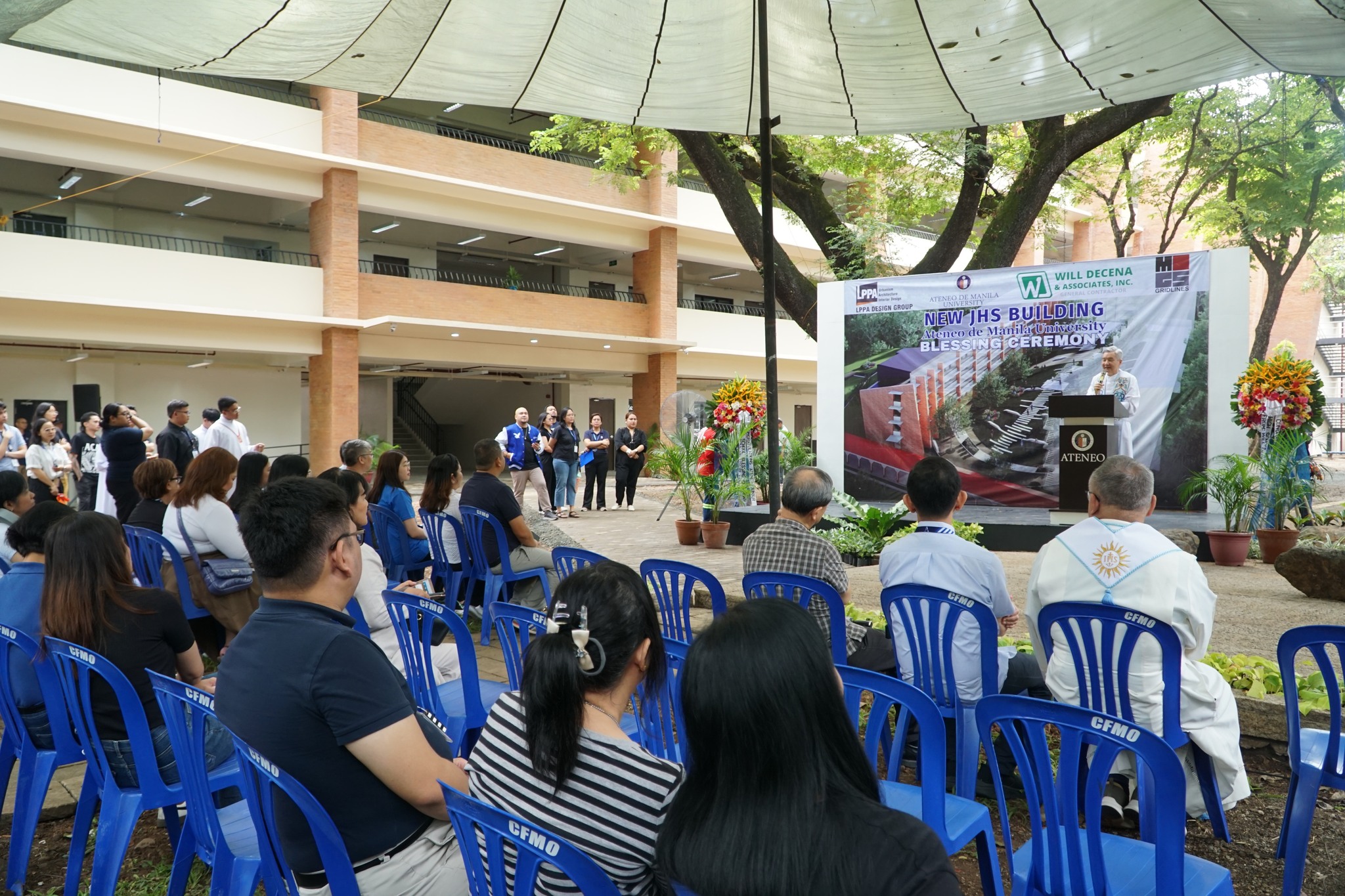 Fr Bobby Yap SJ welcomes guests to the blessing ceremony