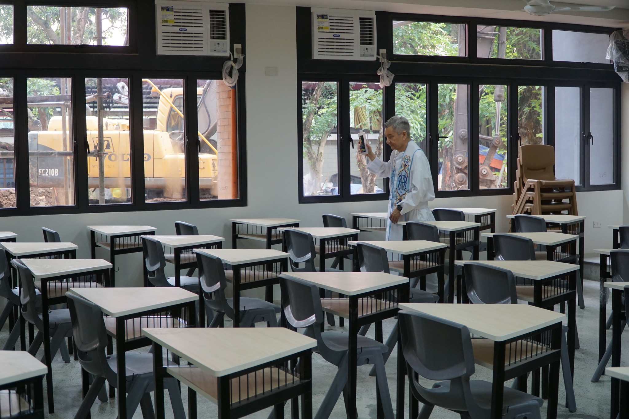 Fr Bobby Yap SJ blesses a classroom on the first floor of the new building