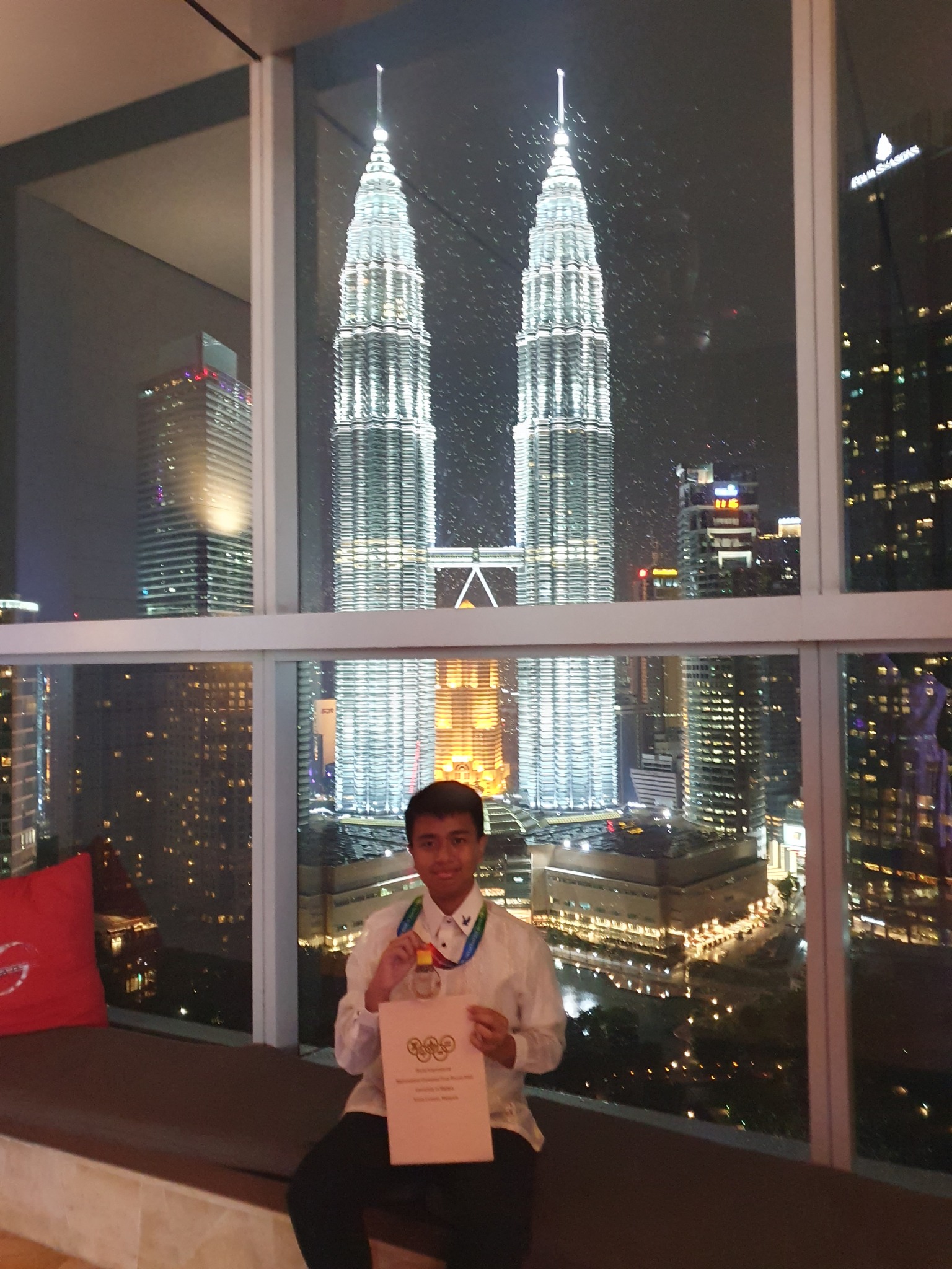 Gerrico Argonza in Malaysia. Note the blue eagle pin on his left collar.