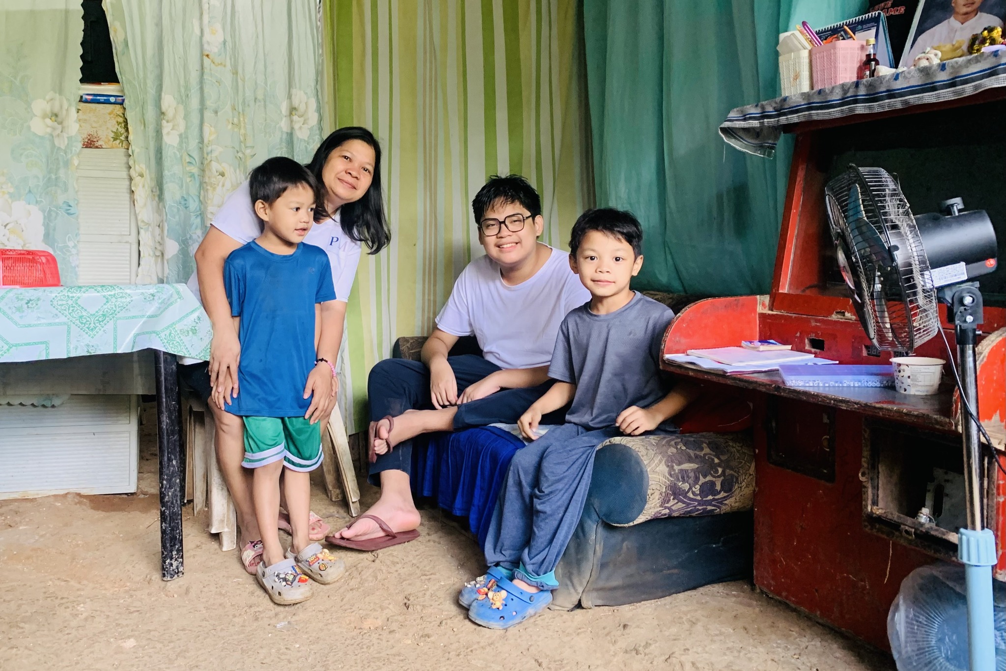 An Atenean (wearing glasses) with his foster family