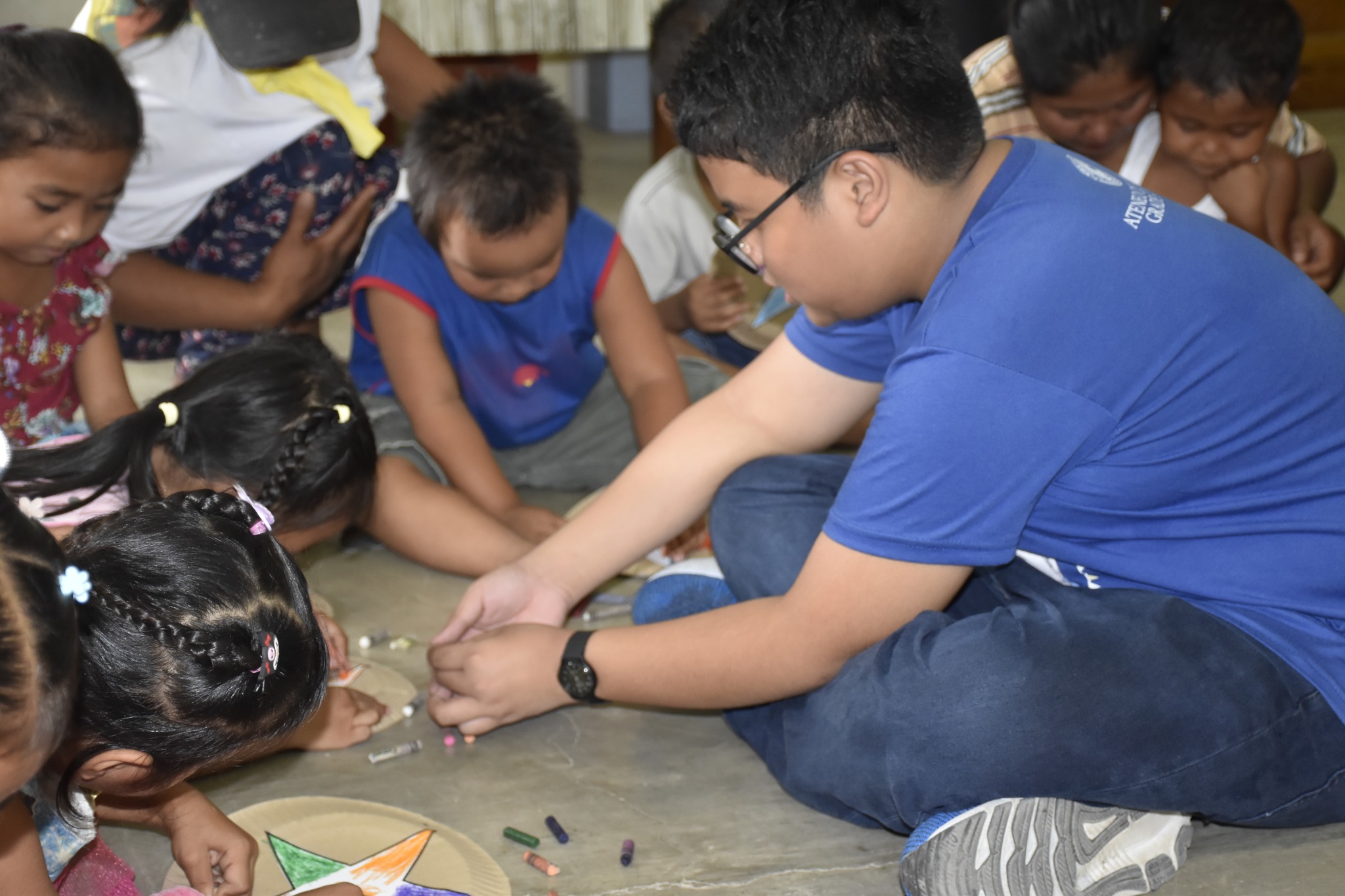 AGS student assisting a child who is making a parol