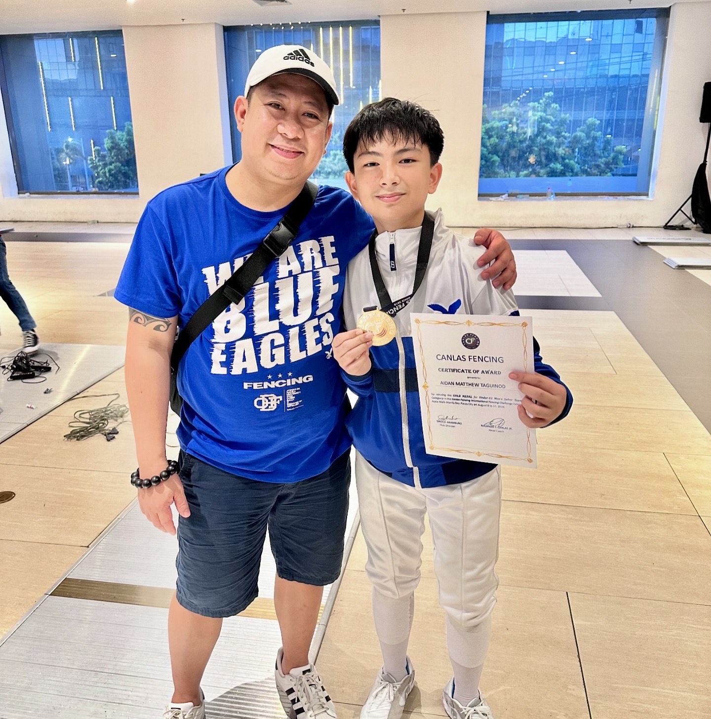 Coach Edward Daliva and Aidan Taguinod 