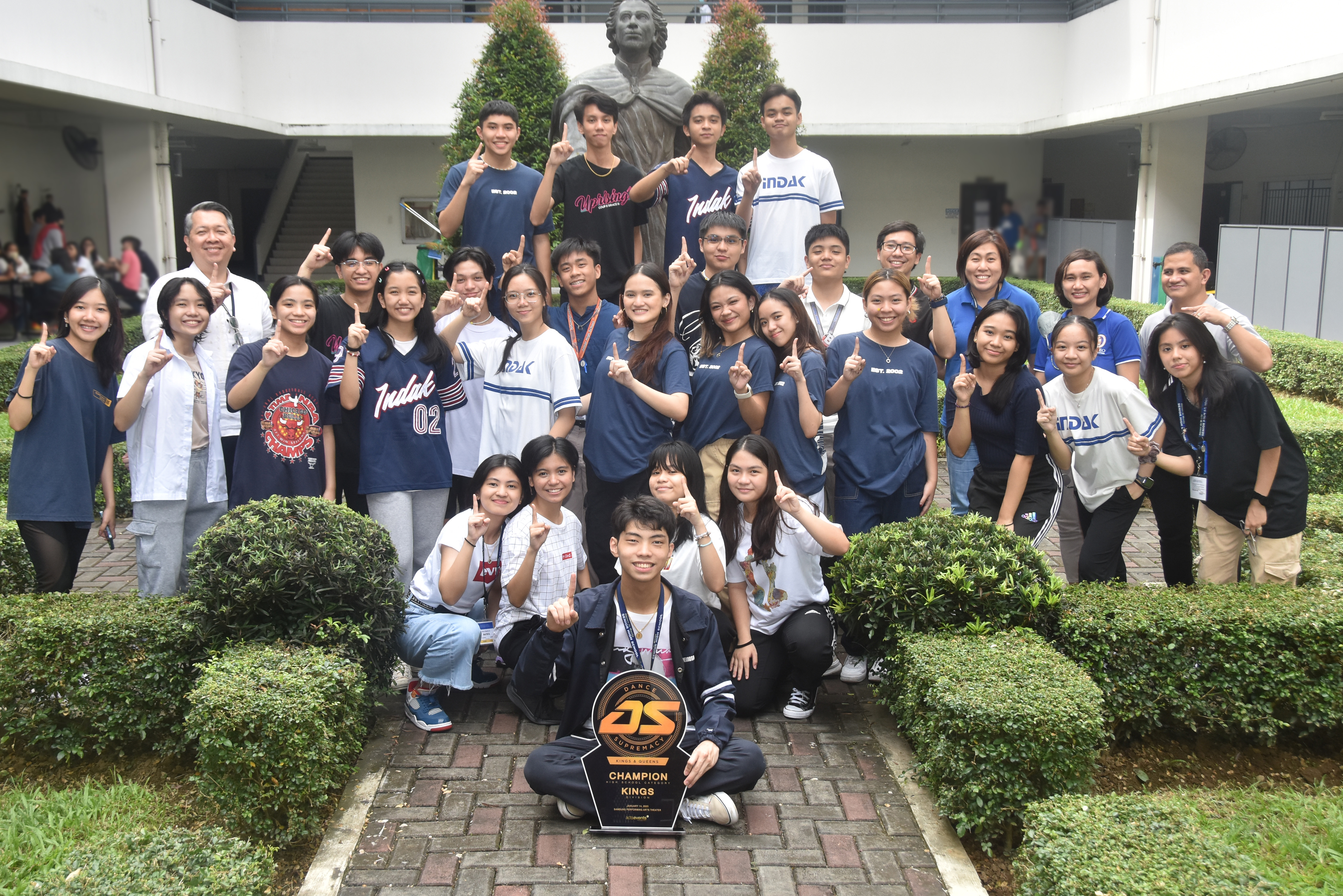 Front and center: Pierre Hermosa (12-Pro, team captain); second row from left: Beatrix Bautista (11-Hurtado), Fiona Velasco (11-Bellarmino), Ayesa Panghulan (11-Mayer), Kristine Maan (11-Mayer); third row from left: Zhiel Chua (12-Kibe), Yumi Caluyo (11-Nakaura), Dana Cloma (11-Borja), Nicole Morales (11-Borja), Shaira Ko (12-Anchieta), Amanda Jamolod (12-Geronimo), Chantal Valentin (12-Walpole), Dominique Cruz (12-Daniel), Shaun Pollisco (12-Holland), Trixie Concepcion (11-Grande), Soleil Jumaquio (11-San Vitores), Shanelle Ko (11-Hurtado); fourth row from left: Noel Miranda, Xean Villacorta (11-Garnet), Audie Secerio (AJHS 10-Mangin), Stephen Materum (AJHS 10-Maunoir), Migo Saavedra (11-Hurtado), Roque Bonifacio (AJHS 10-Ferreres), Julio Morato, Jen Concepcion, Czel Lacson, Javy Fabello; top row from left: Joaquin Hizon (12-Evans), Matthew Tanchoco (12-Bobola), Joaquin Casiquin (12-Navarro), DJ Cruz (11-Brebeuf); not in photo: Mya Soriano (12-Miki)