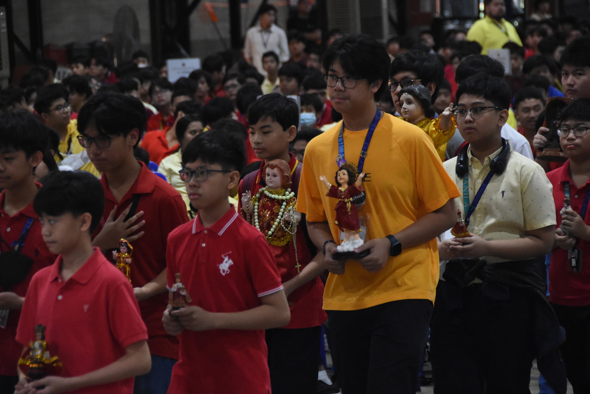 Some of the students who brought images of the Sto Niño to the Mass