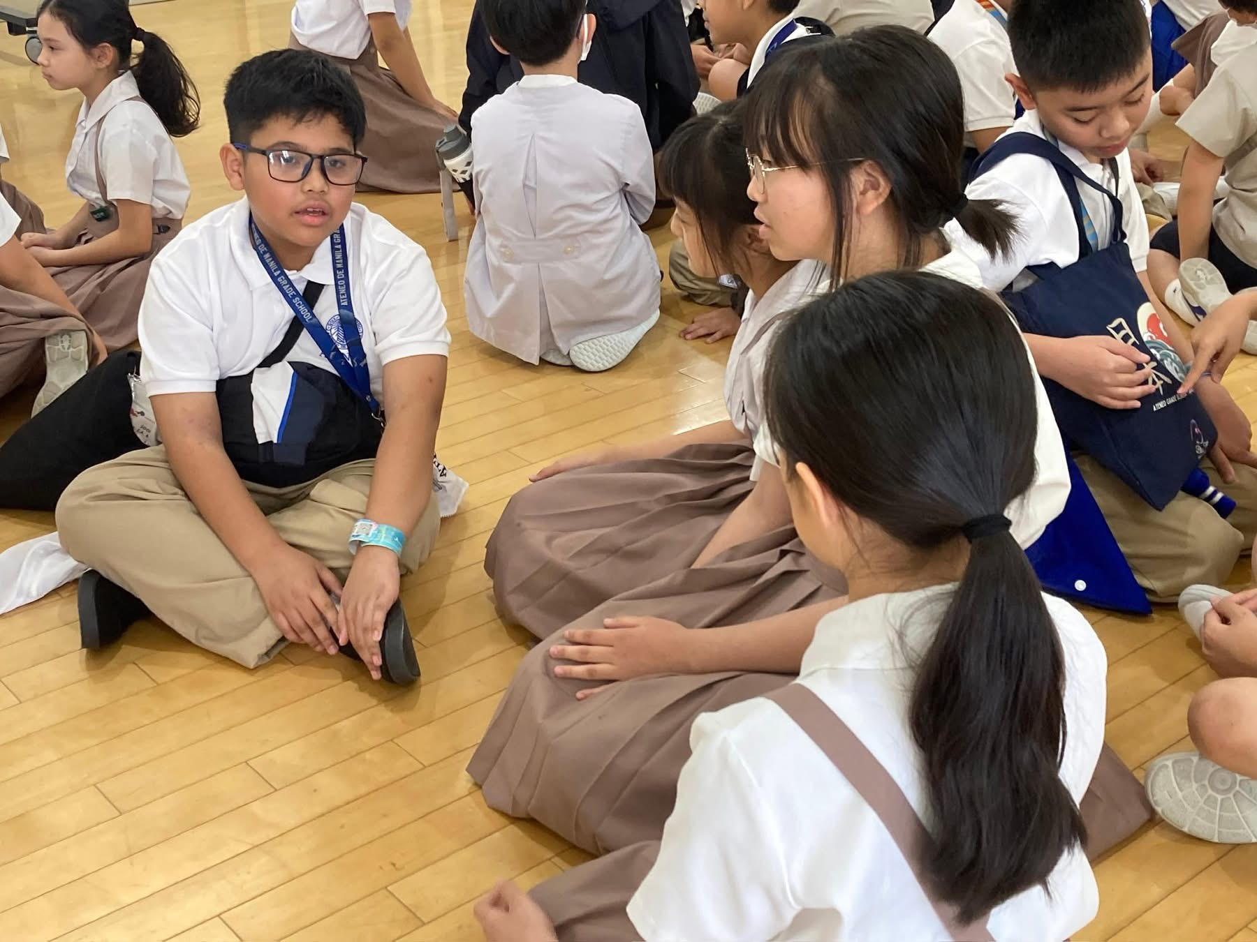 Mojica in a classroom at Notre Dame Seishin Elementary School irls of Seishin