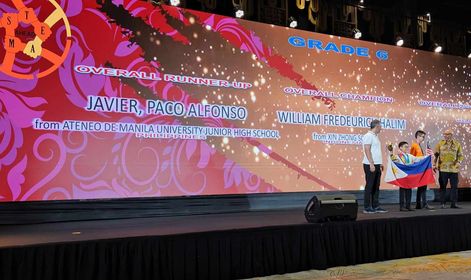 Paco Javier (holding the Philippine flag) at the STEAM Ahead awarding ceremony in Indonesia