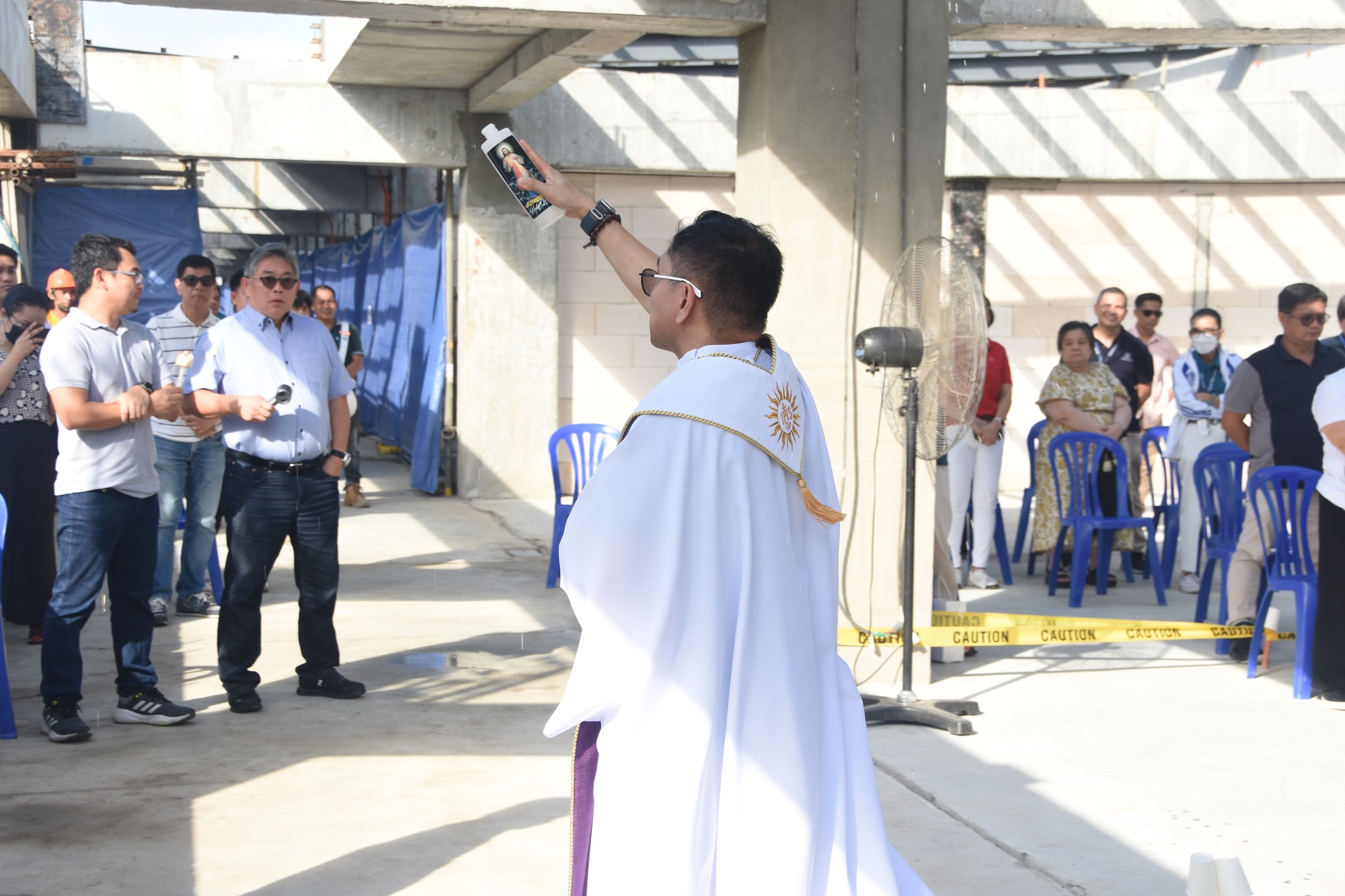 Fr Mamert Mañus SJ blesses the building