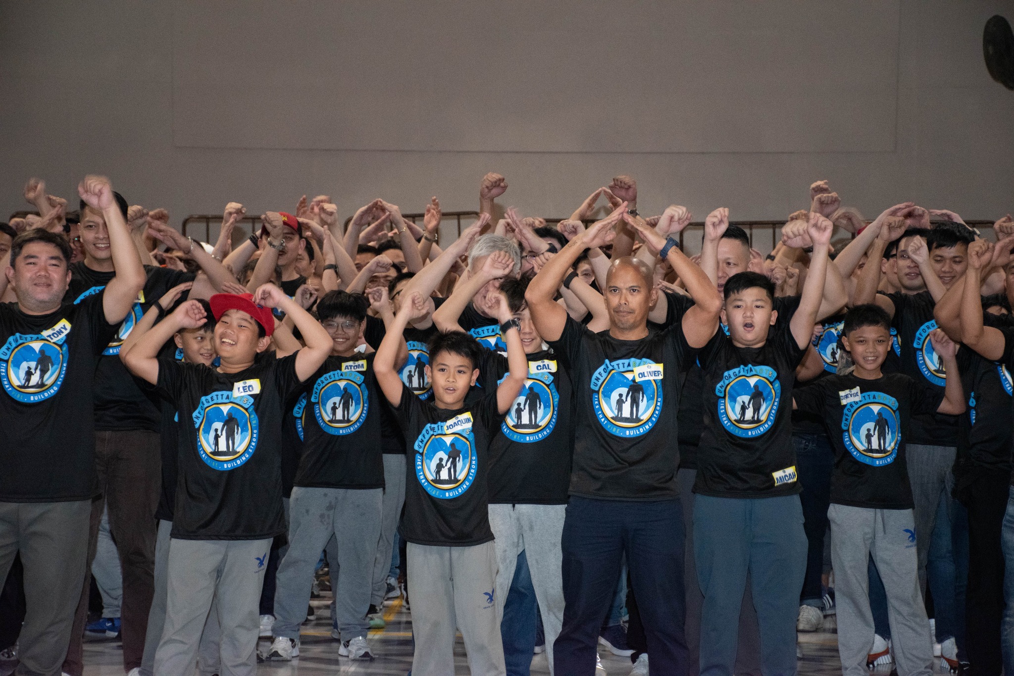 Fathers and sons perform their team cheer to start the BBN festivities