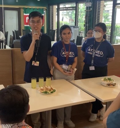 Students explain their dishes to the panel