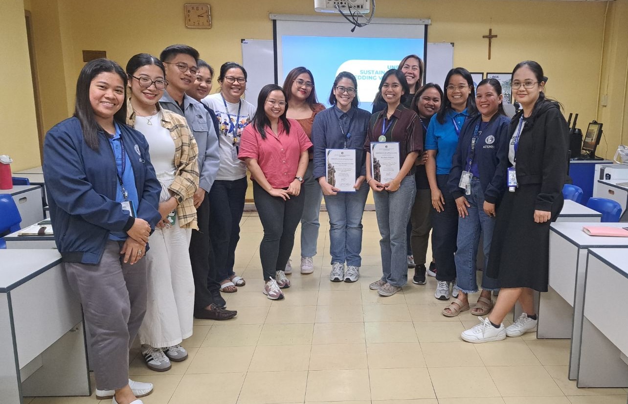 Facilitators and participants partake in a post-event group photo