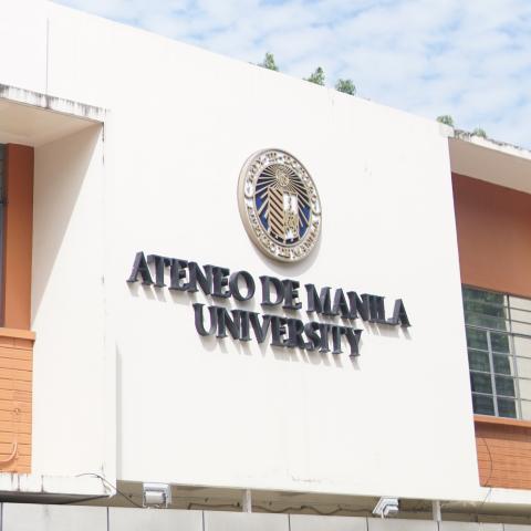 Close up of University seal and logo at Xavier Hall