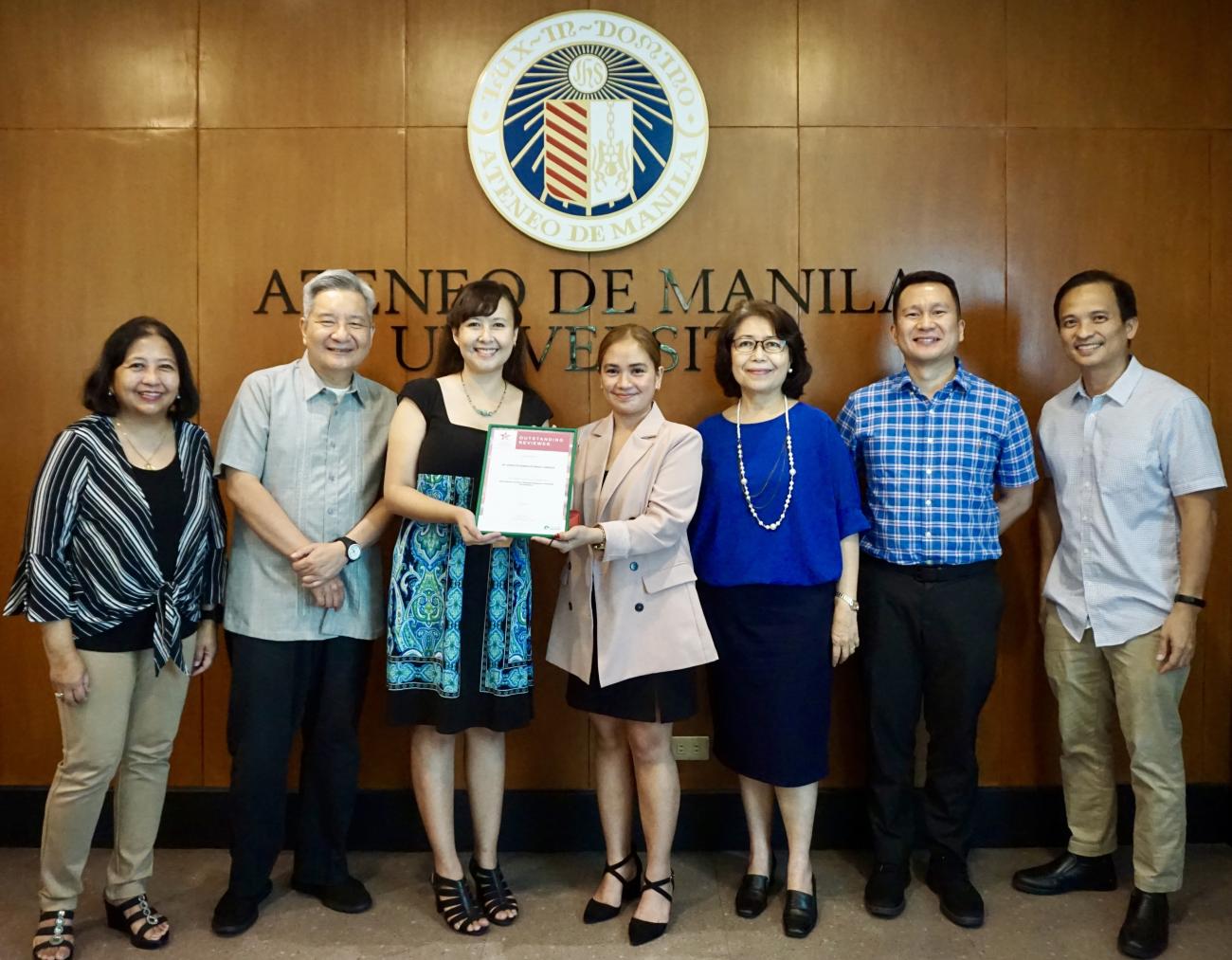 Dr. Charlotte Kendra Gotangco Gonzales (3rd from left) receives the Outstanding Reviewer Award