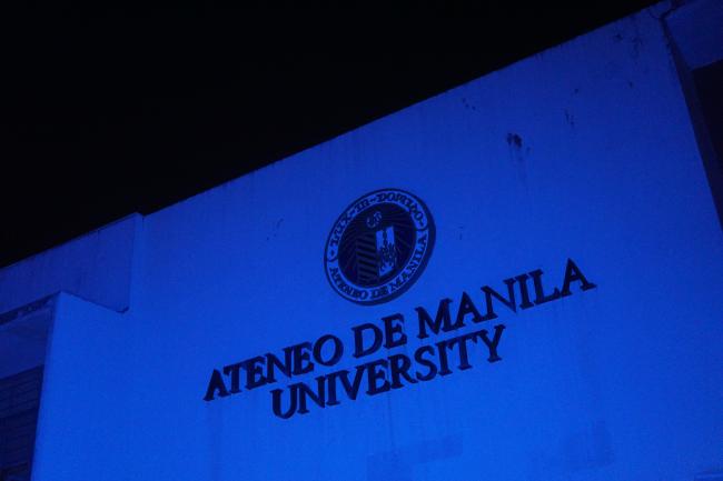 Xavier Hall floodlit in blue light